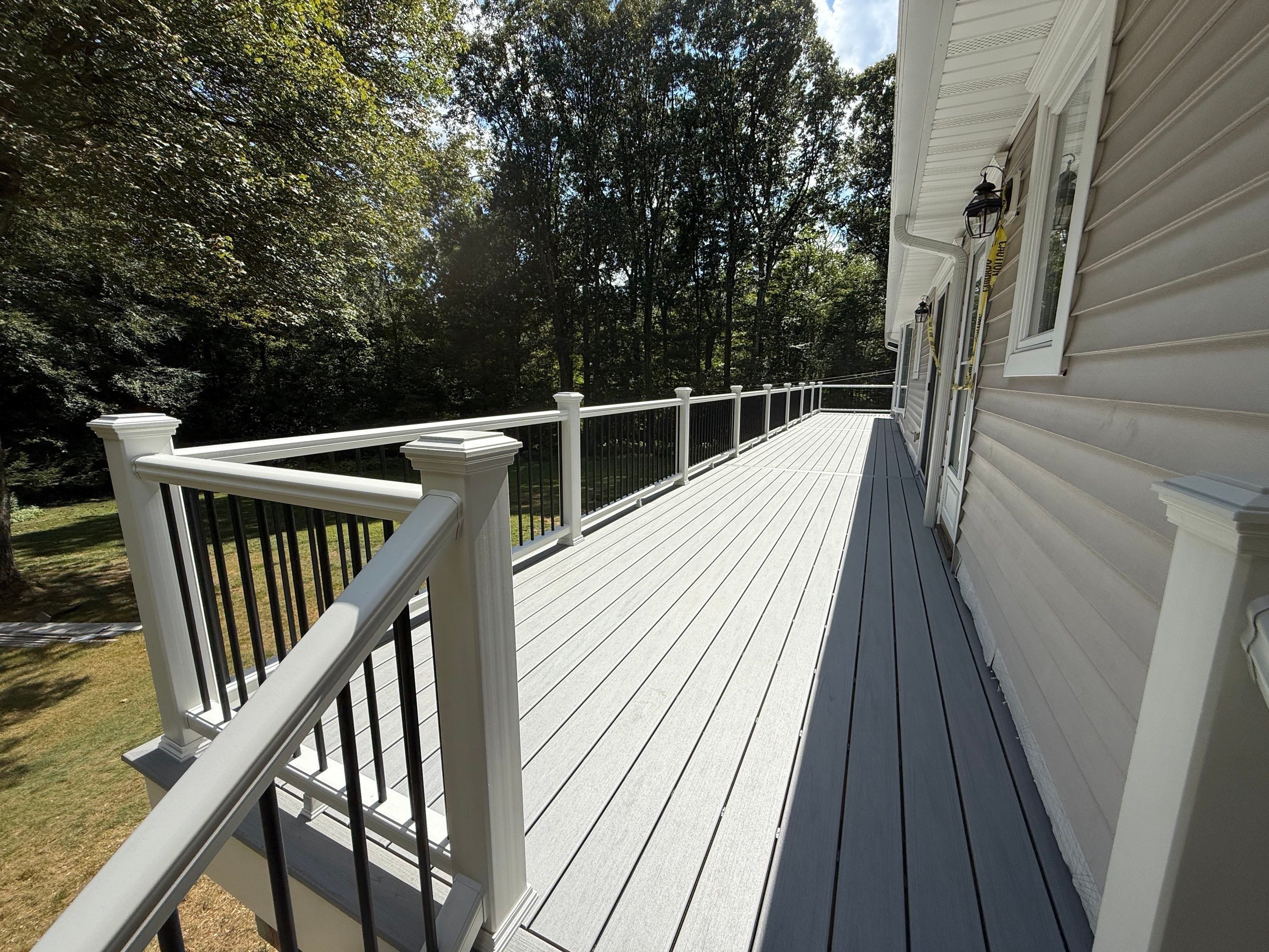 Replacement of front and back decks using Trex Lineage Island mist and Trex Lineage Rainier by DiGiorgi Roofing and Siding Inc