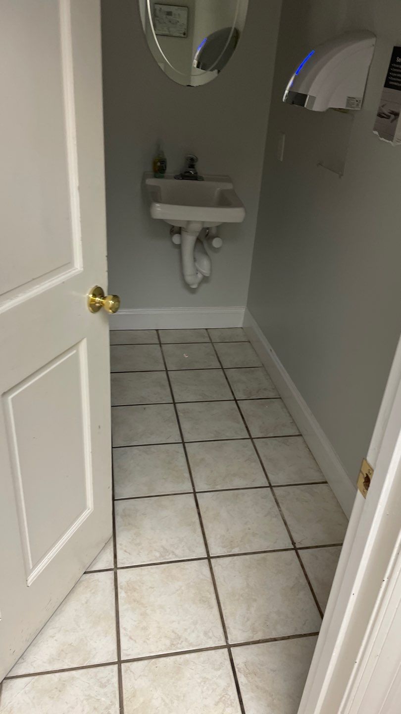 Office Remodel from Worn Out Carpet to Sleek Glued Down LVP by Footprints Floors of Coastal Carolina