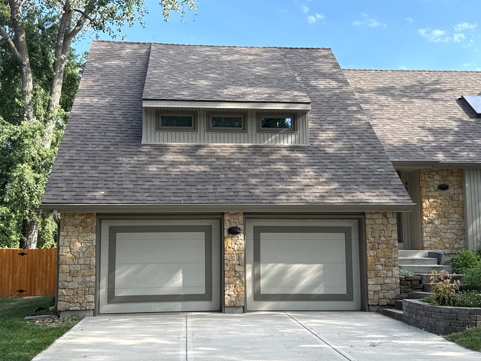 Comprehensive Kansas City Exterior Remodel Featuring Board And Batten Siding by EEC Windows, Siding & Roofing
