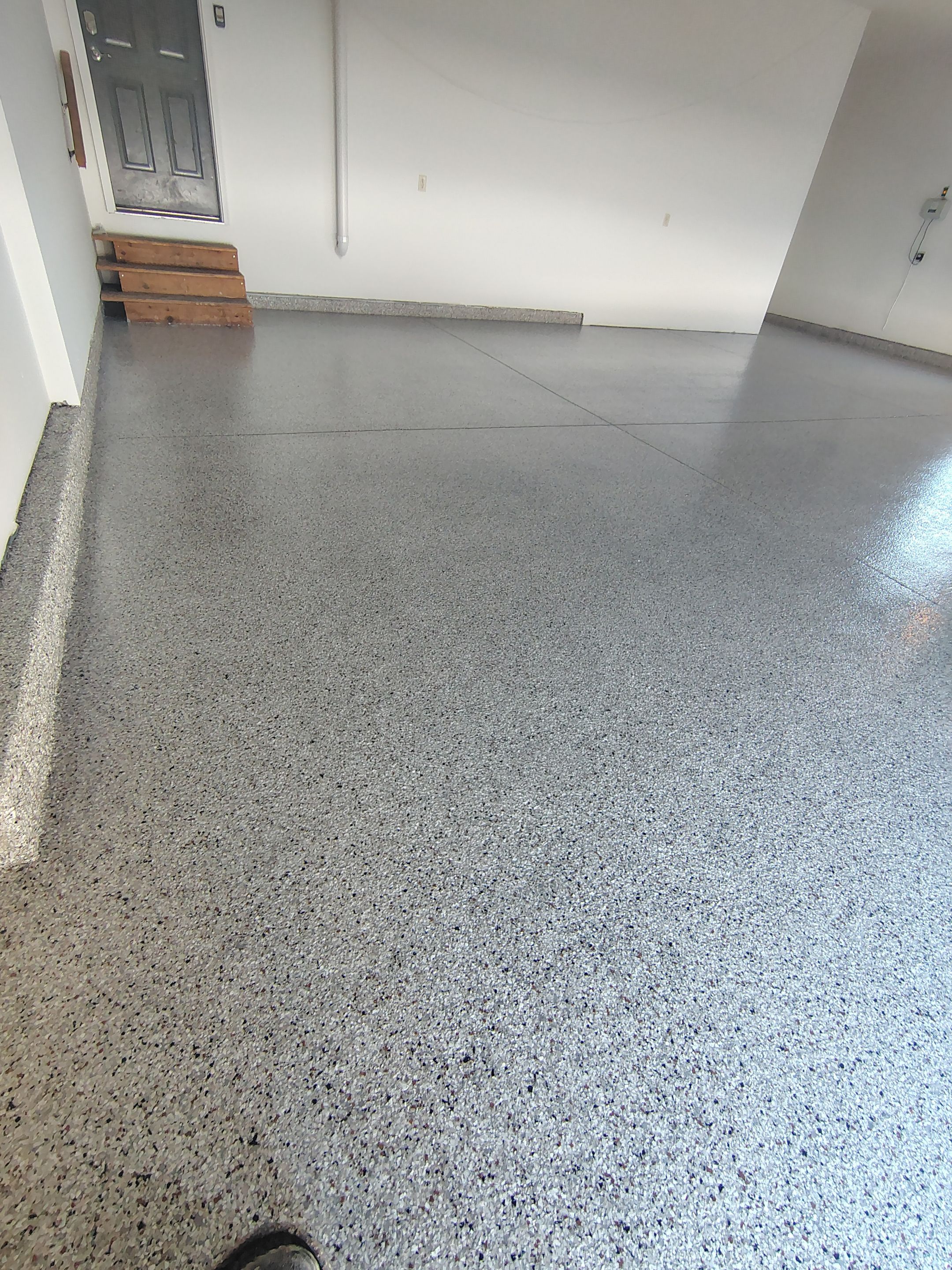 Custom Grey Speckled Epoxy Floor Coating for Sioux Falls Garage by Select Painting, Coatings & Garage Cabinets
