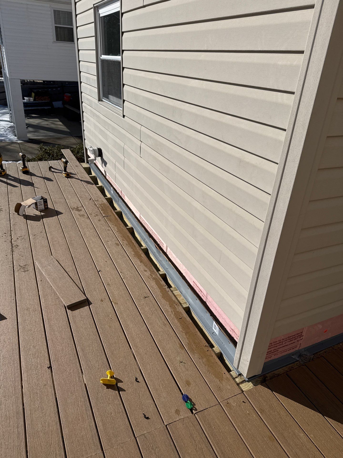 Deck and door by Cousins Roofing Siding & Decks