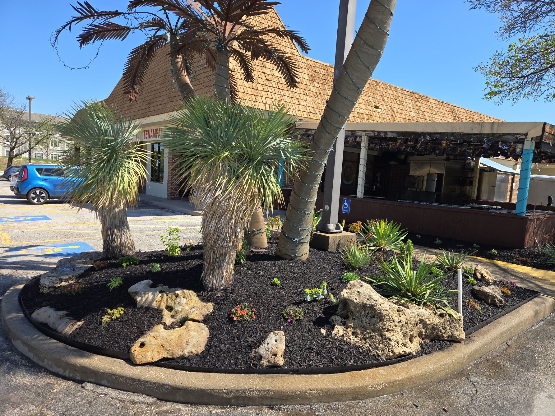 Restuarant Landscape Installation and Parking Lot Islands in Lenexa by LAND ESCAPES LLC
