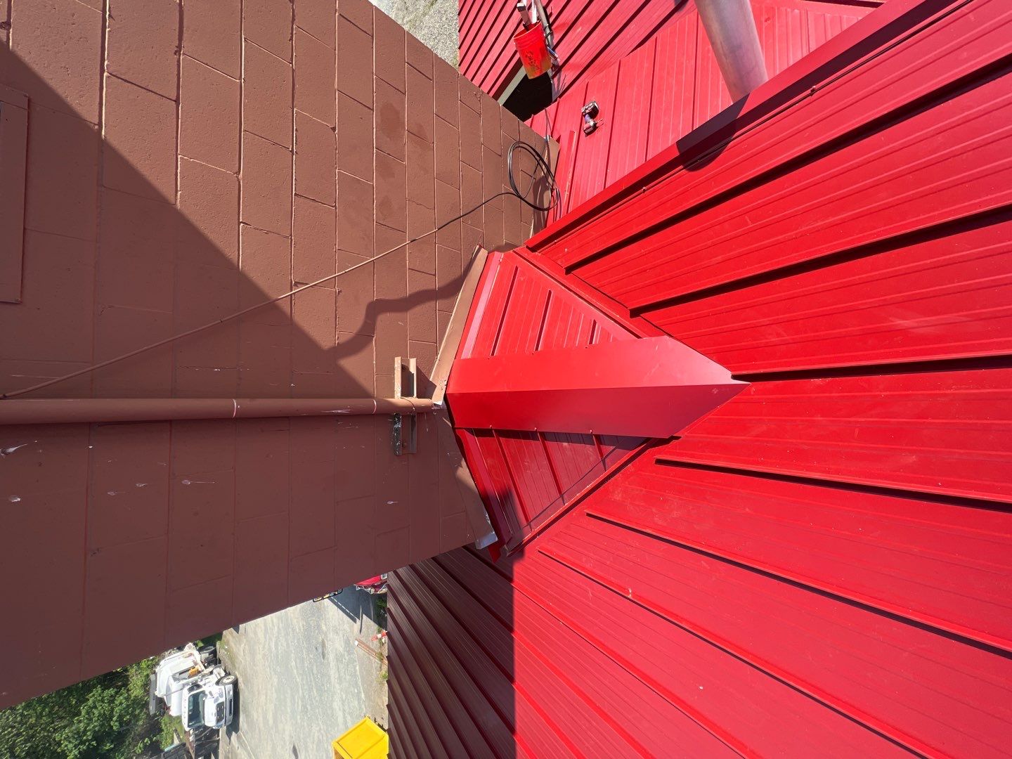 Commercial Roofing Installation using 12" Prolok metal  by Top Notch Roofing Inc