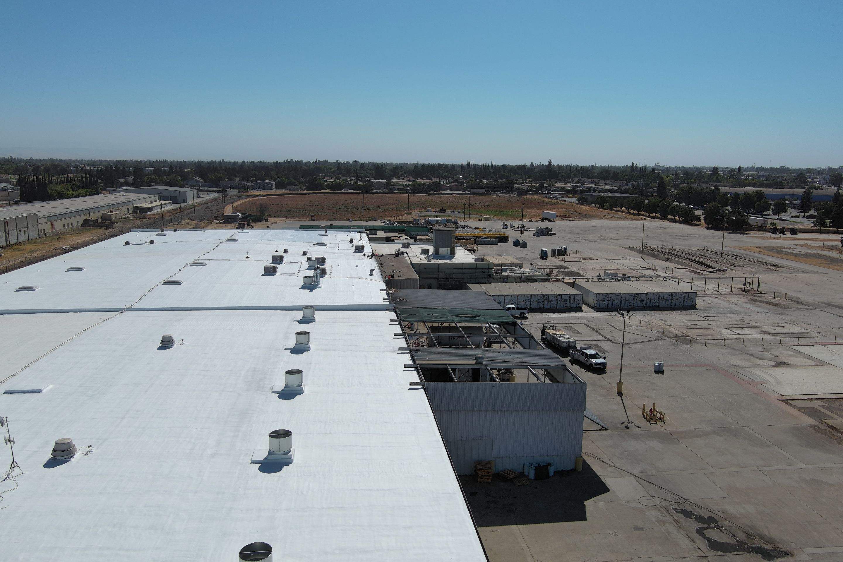 Pro Farms Spray foam roofing project by Straight Edge Roofing Inc