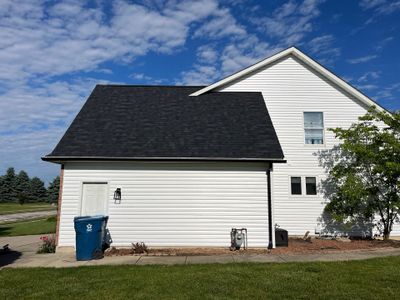 Exterior Installation using Onyx Black Durations and White Siding