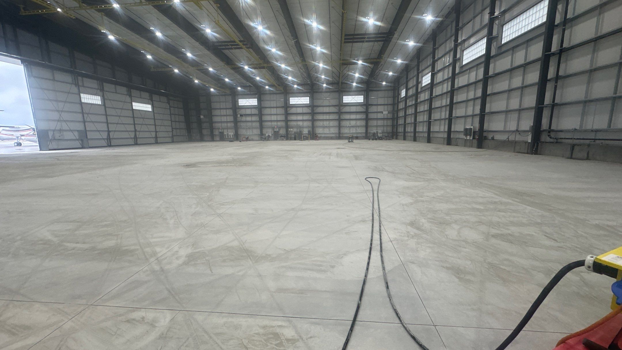 Airplane Hanger using Light Grey Commercial Penntek Epoxy by Croc Coatings, LLC