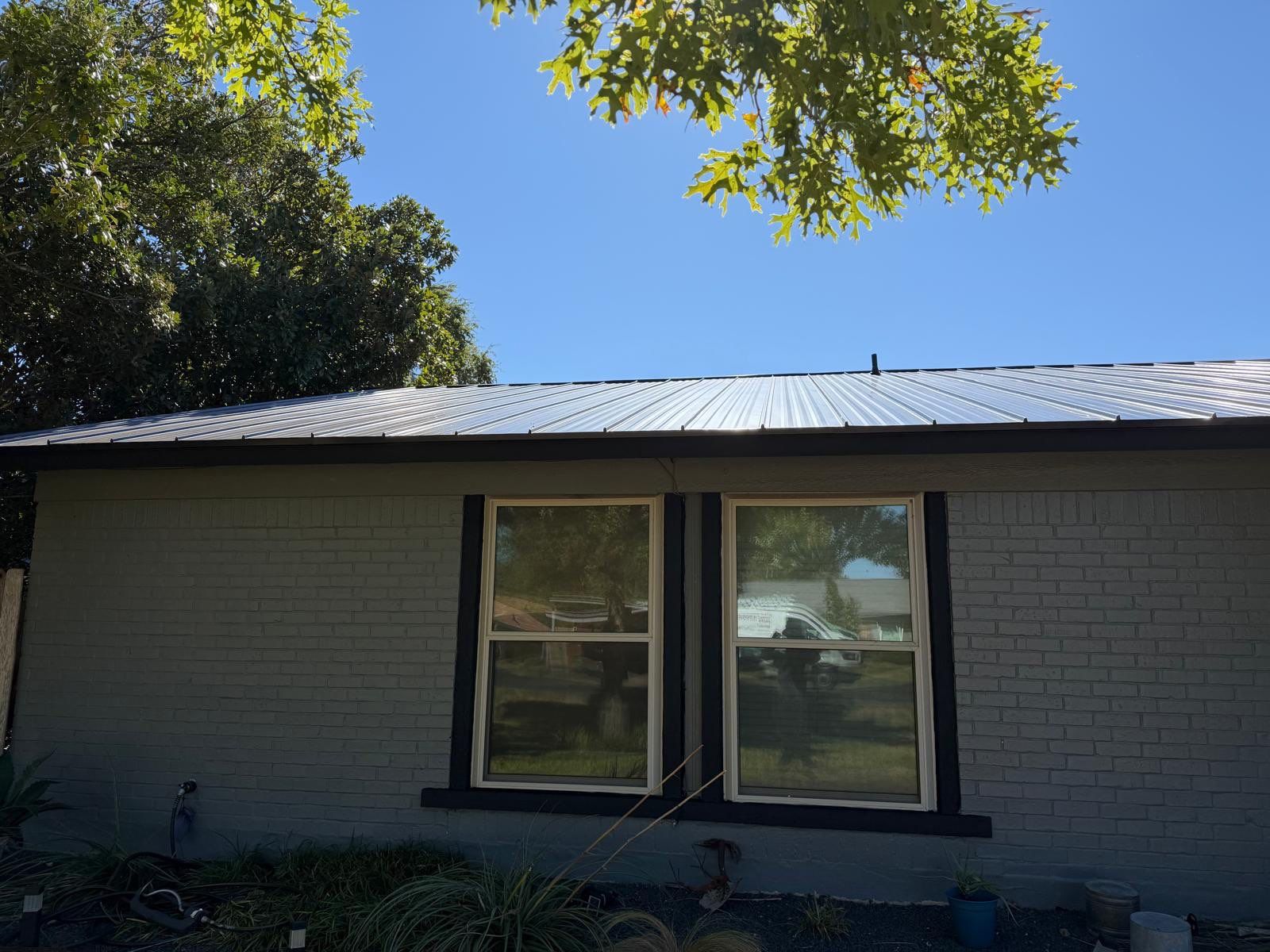 Residential Roof Replacement using Matte Black 24g by Action Exteriors Austin