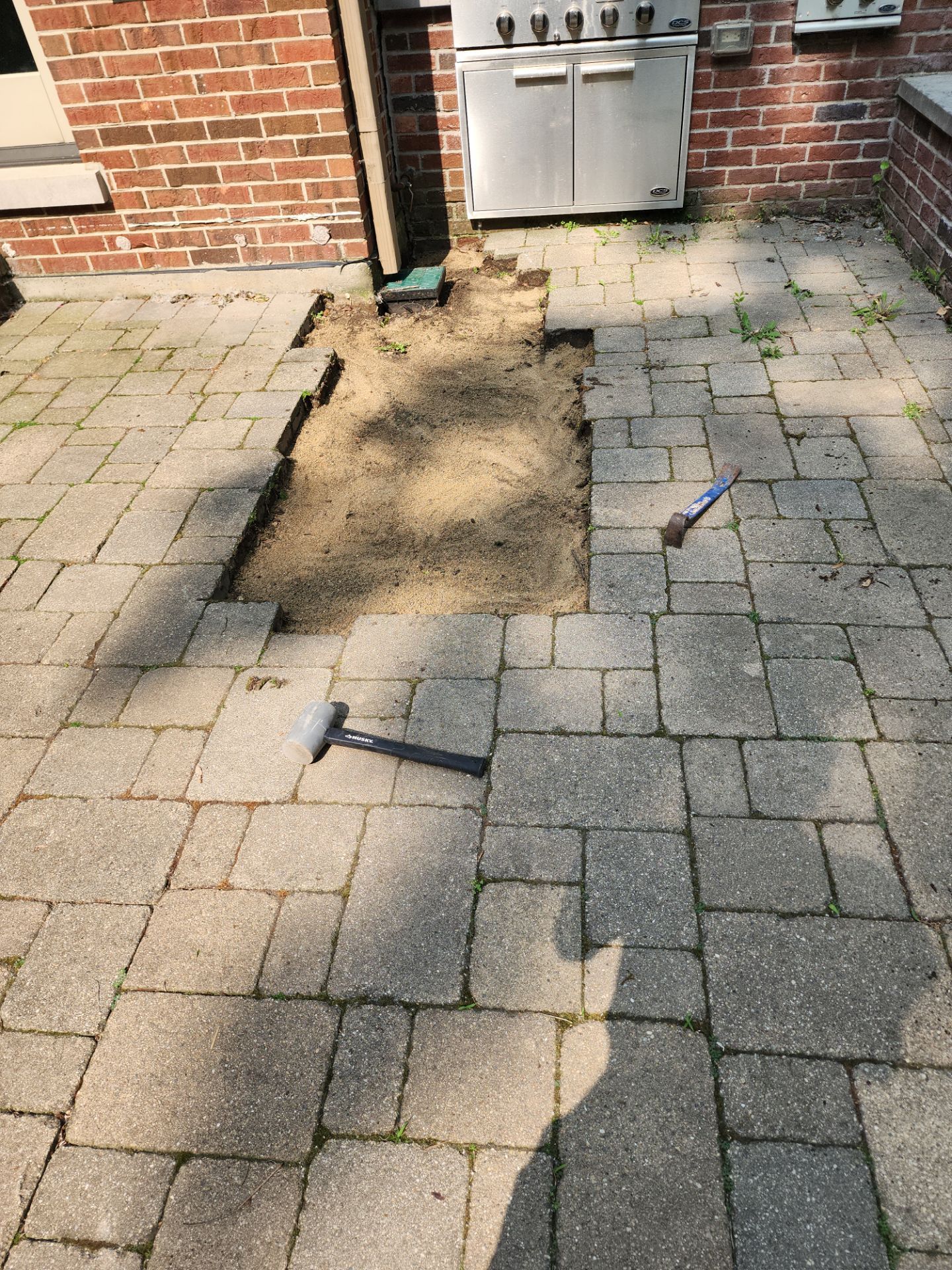 Brick paver repair, clean, seal and poly sanding by Northern Power Washing LLC.
