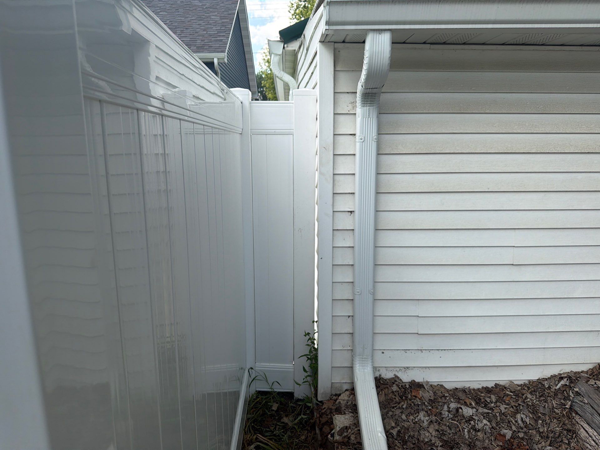 White Vinyl Privacy Fence Installation in Waterloo, Iowa by Perfect Picket Fence and Stain