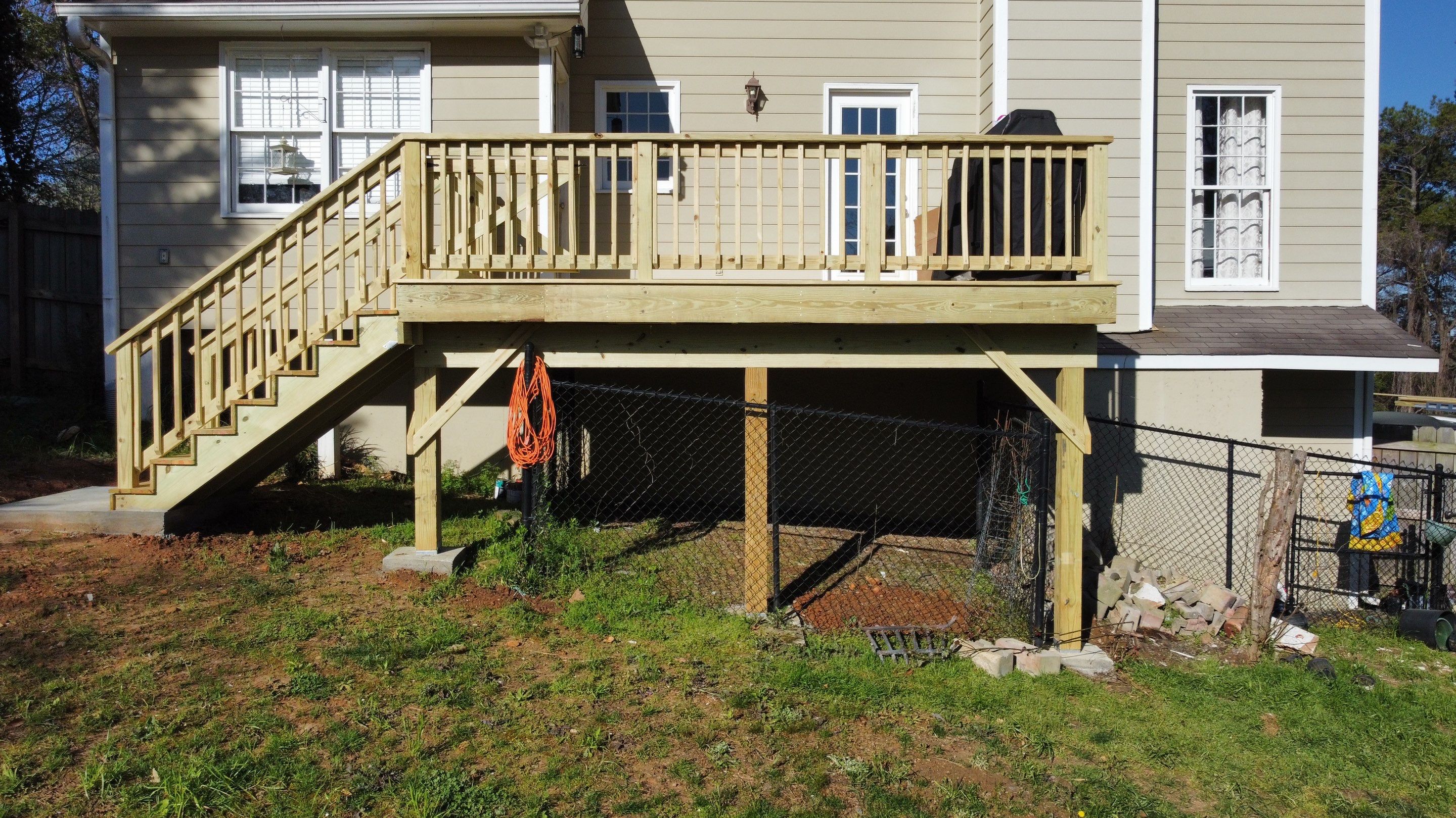 Elevated Pressure-Treated Wood Deck Replacement in Marietta by Swift Home Renovations