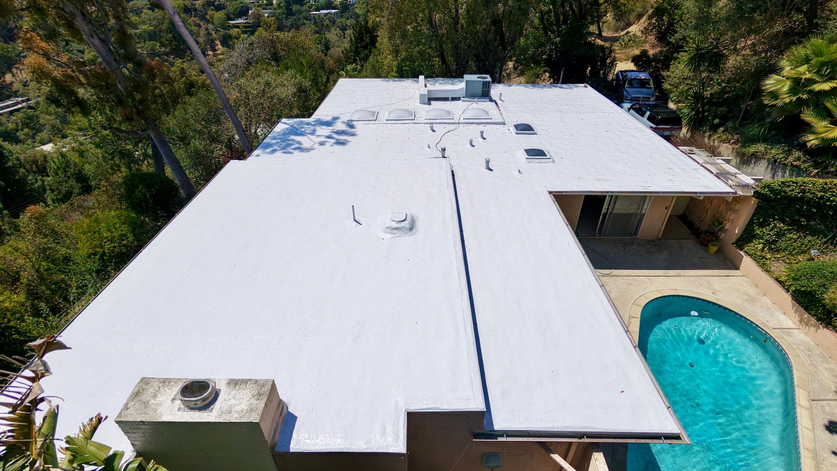 Residential Flat Roof Restoration with Silicone Coating in Brentwood by Hull Brothers Roofing