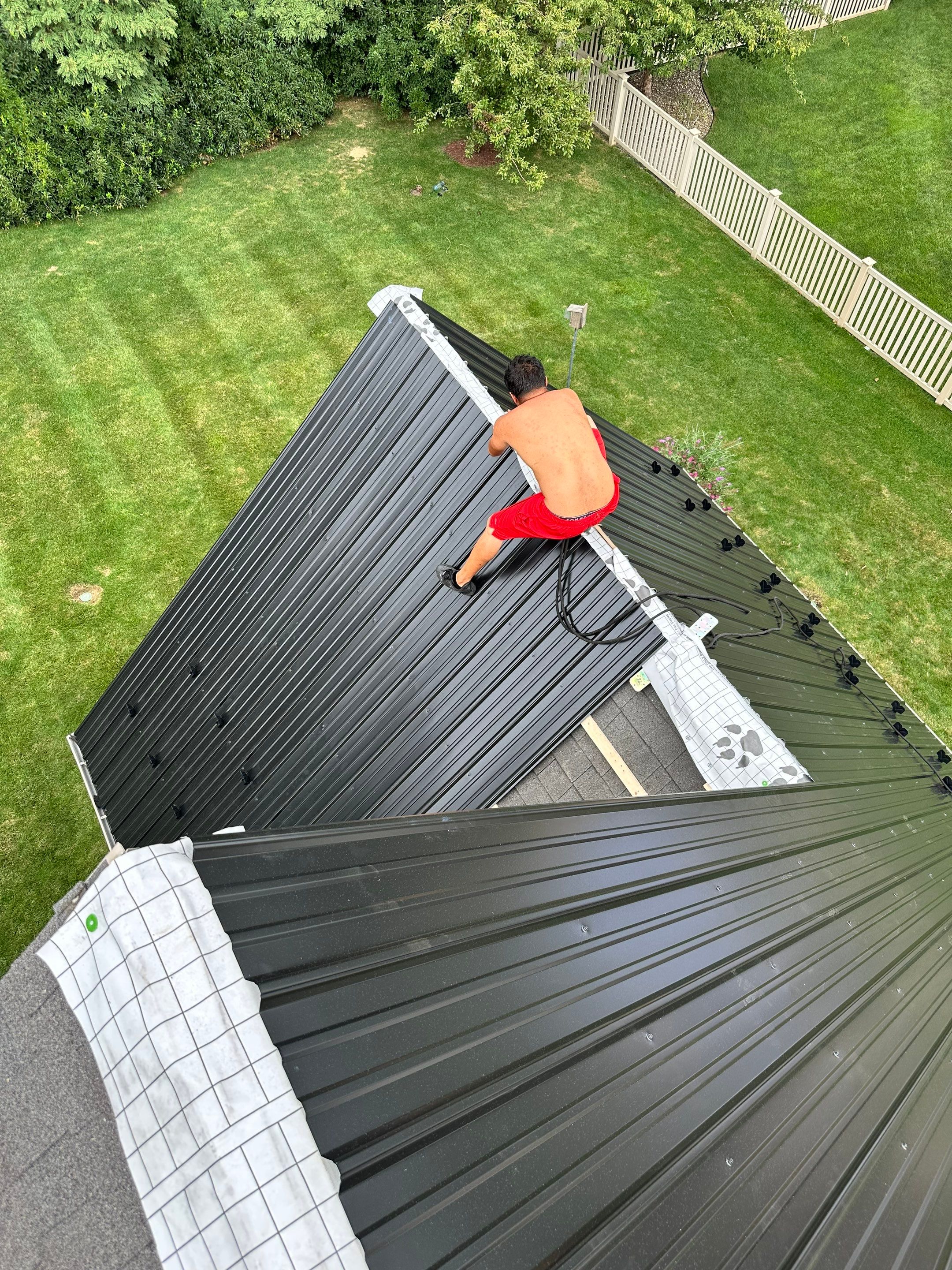 Standing seam / Azm panel in black  by Teflon Roofing