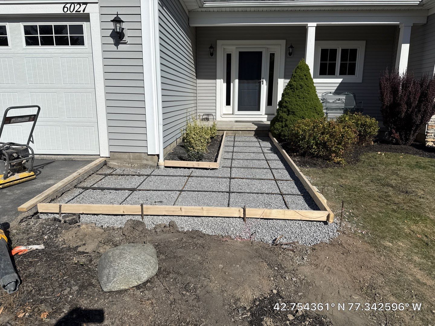 Stamped English Rivenstone concrete patio and sidewalks  by NG Masonry & Construction LLC