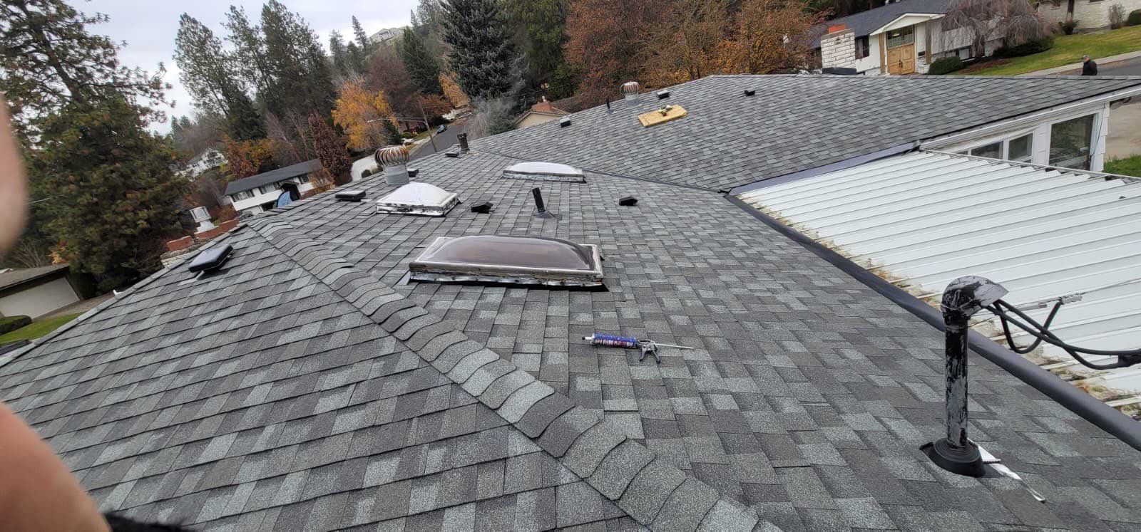 Residential Asphalt Shingle Roof Replacement and Skylight Installation in Spokane by Alpine Roofing