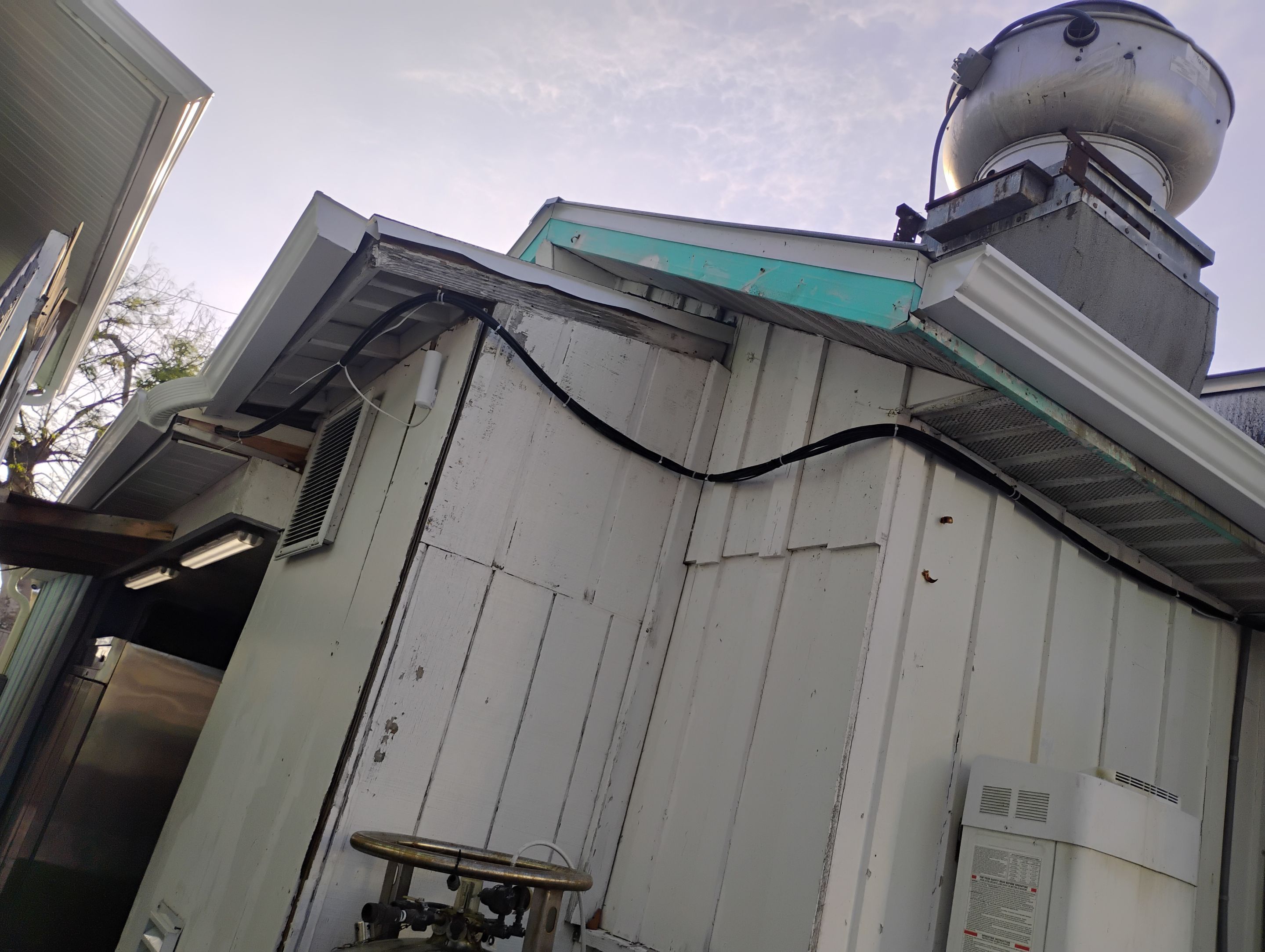 Commercial Downspout Installation in Captiva FL by Gutter Professors