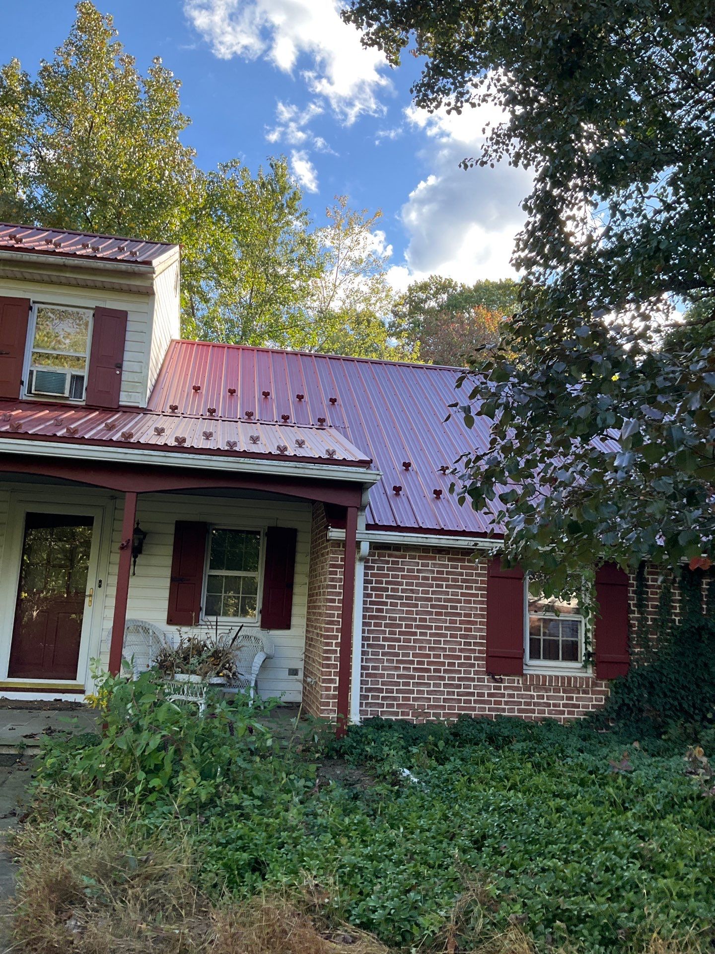 Red Metal Roofing Installation and Trim Restoration in Bernville by Esh Builders