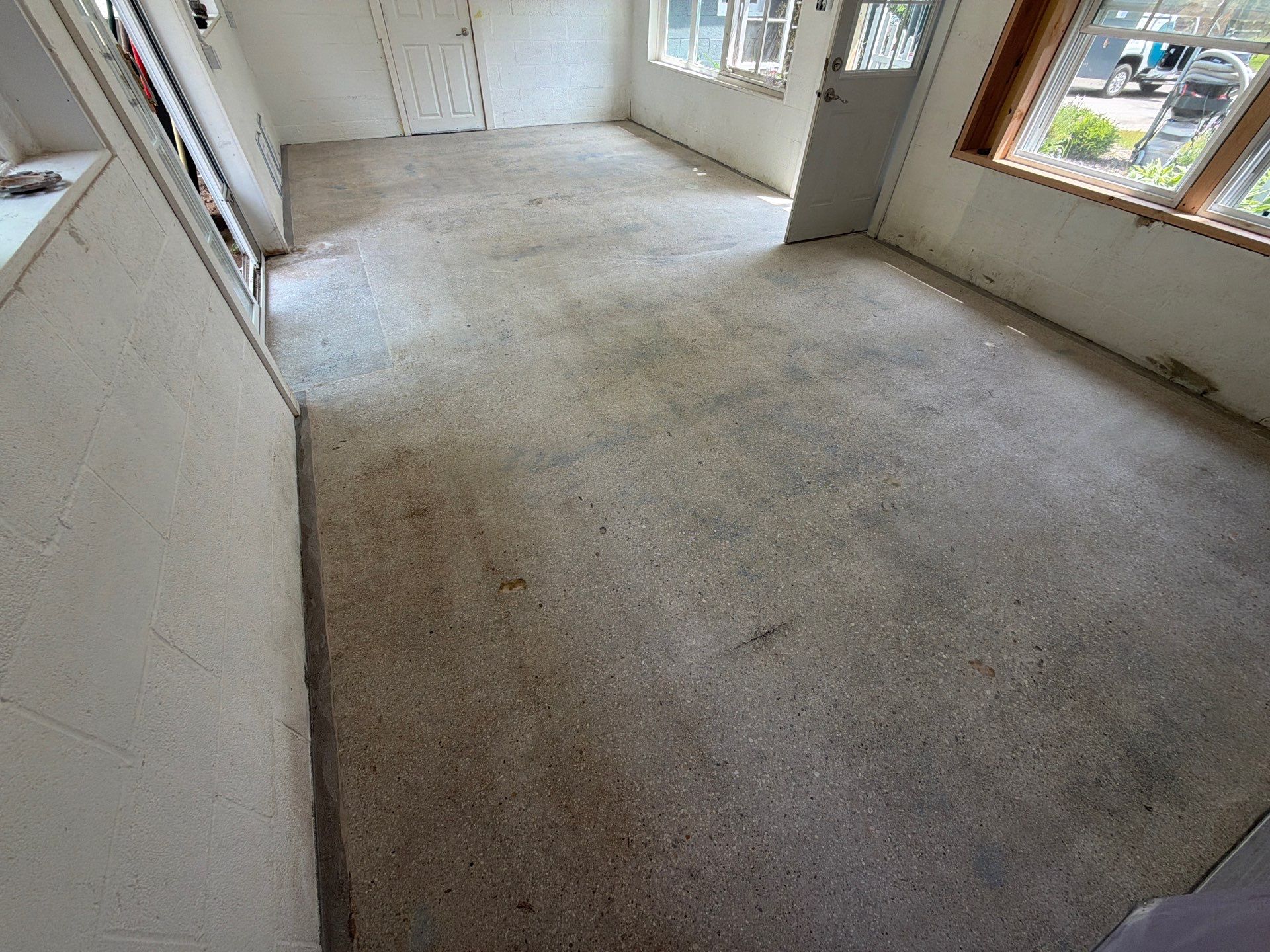Grey Epoxy Flake Floor Installation for a Muskegon Sunroom by Gordon Painting