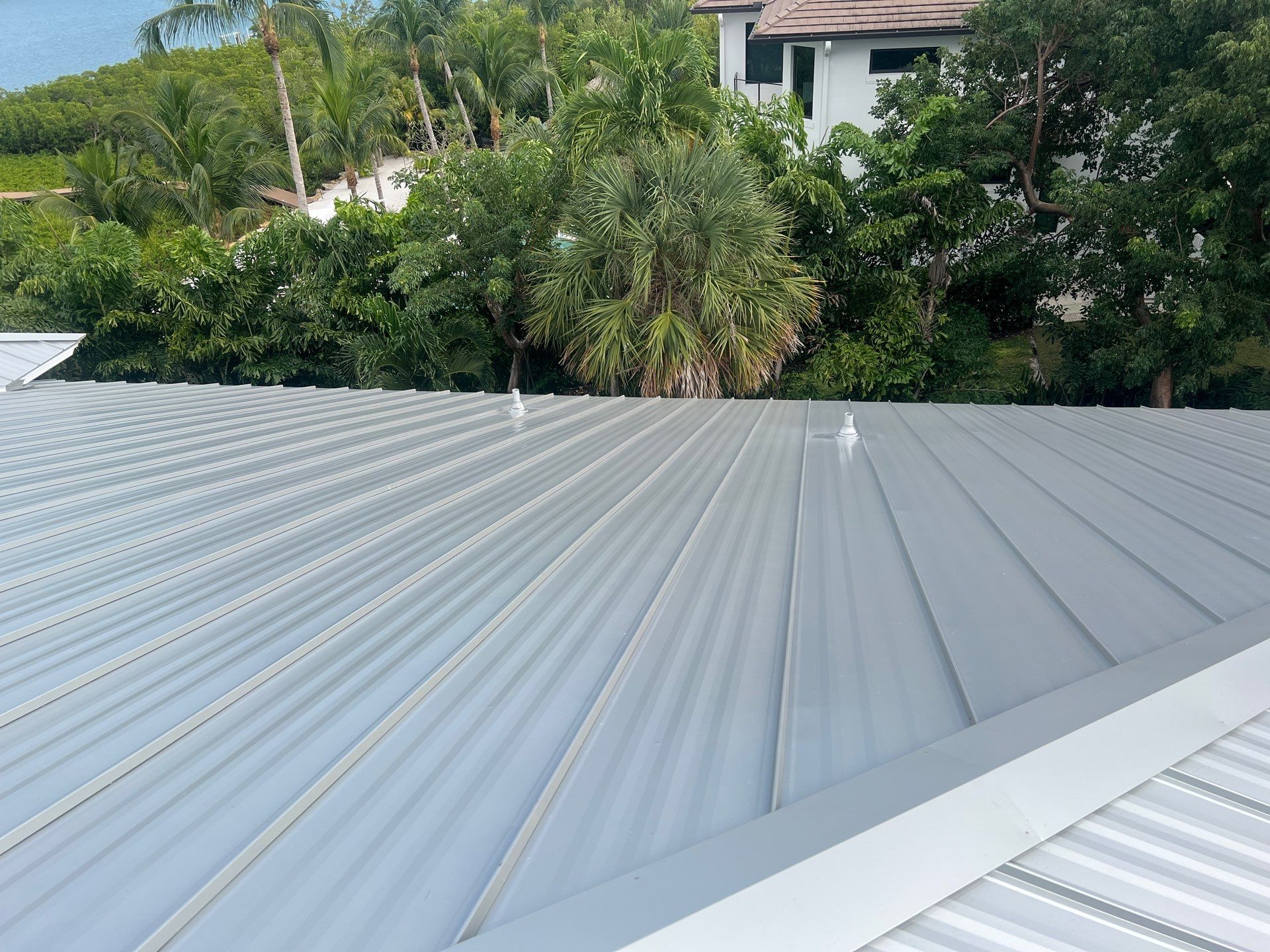Residential Roofing Installation using Galvalume Standing Seam by Durabilis Roofing INC