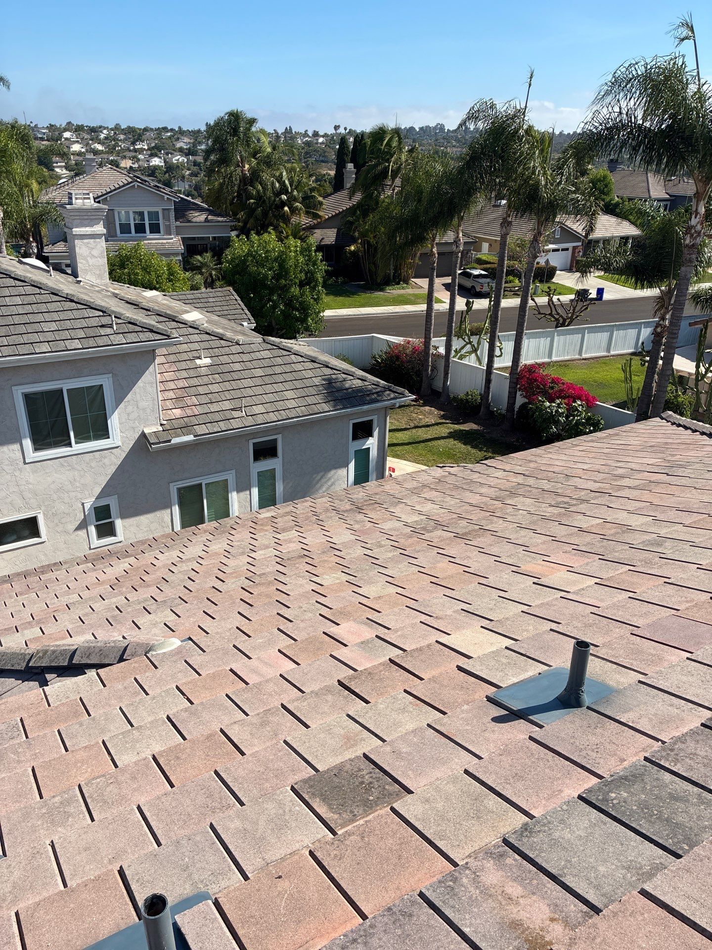 Carlsbad Concrete Tile Roof Replacement with Copper Flashing and Skylights by Reliable Roofing San Diego Inc.