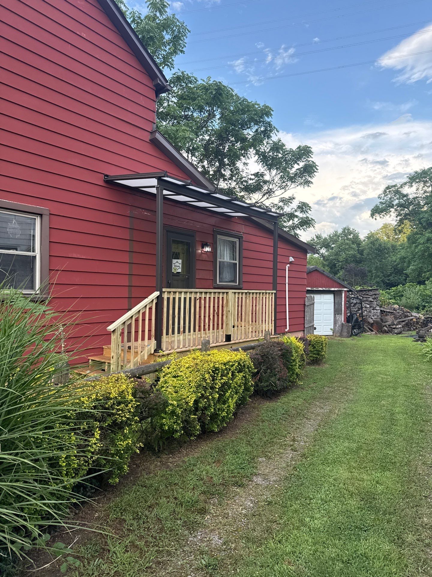Roof sunspace deck  by Cousins Roofing Siding & Decks
