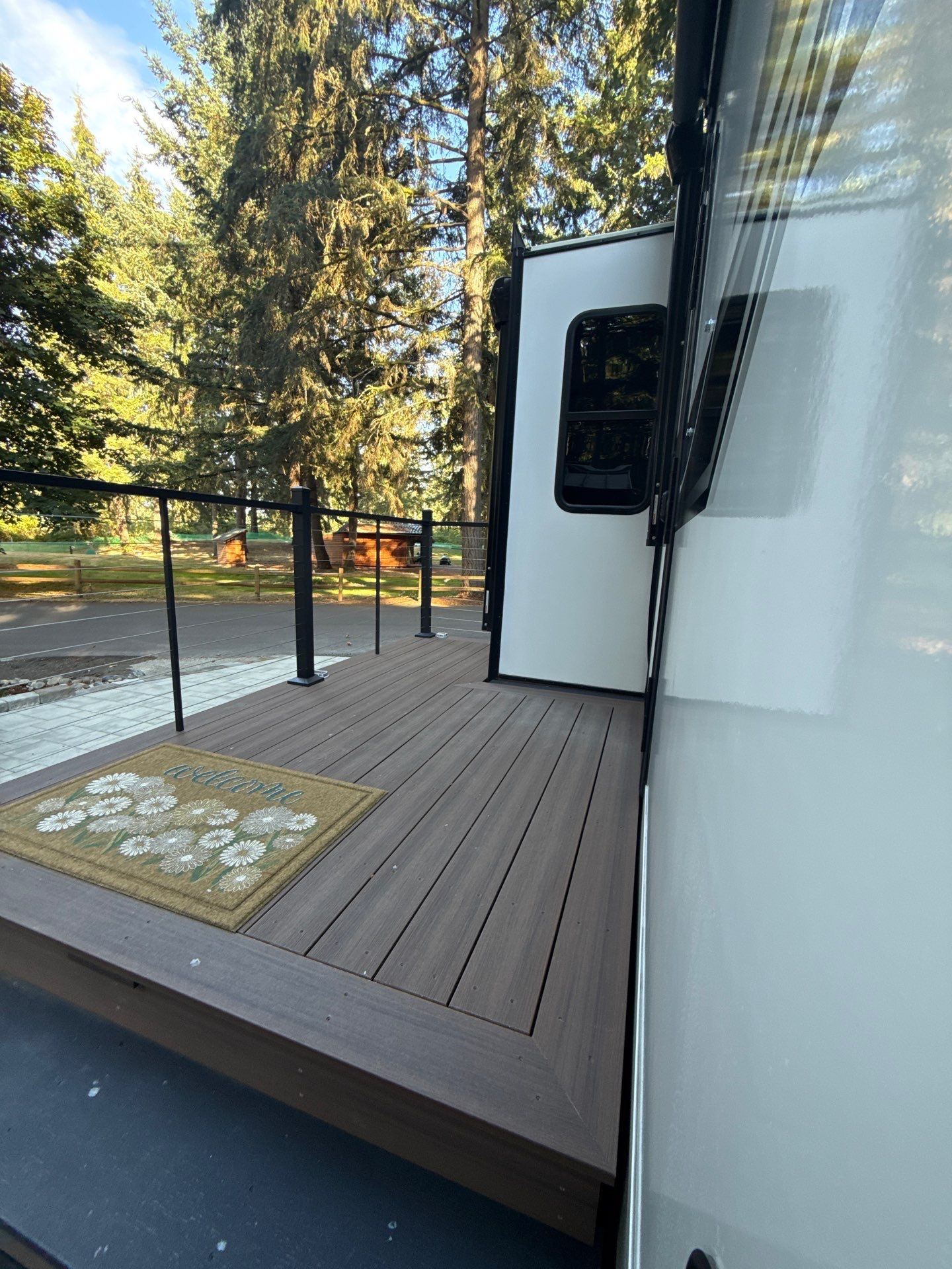 Custom Composite Deck with Cable Railing and Paver Patio in Olympia by Expedeck