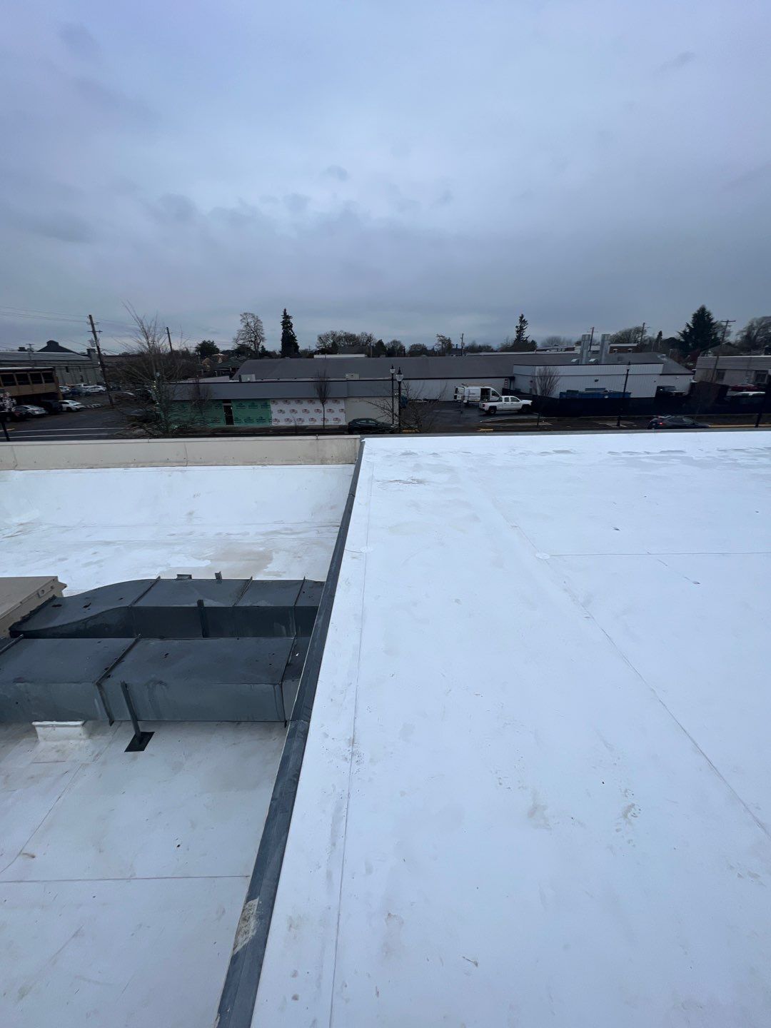 Commercial Flat Roof Installation using GAF 60Mil TPO  by Orezona Building & Roofing Company, Inc.