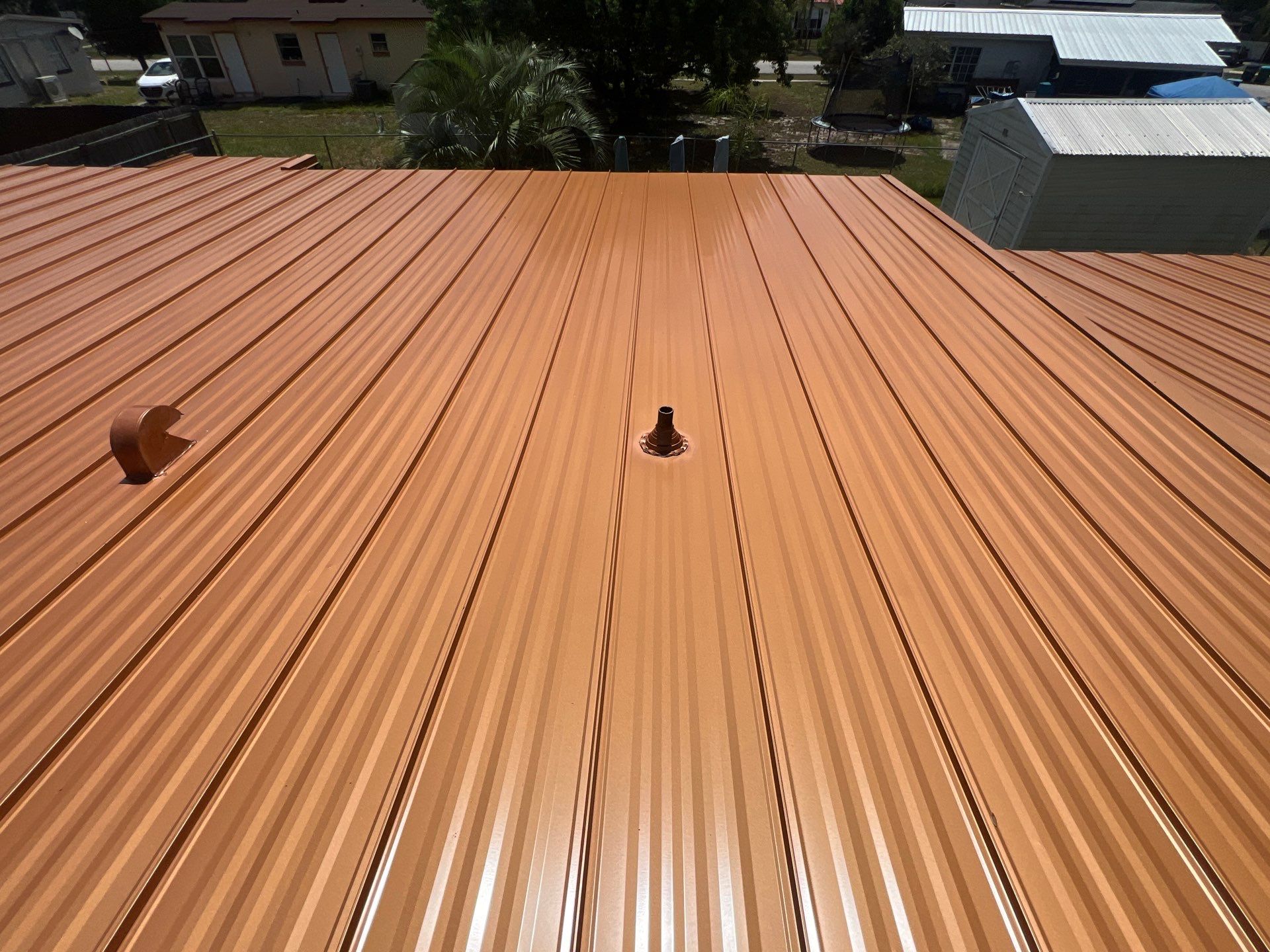 Standing Seam Metallic Copper Metal Roof Replacement in Deltona by Pinnacle Roofing Group