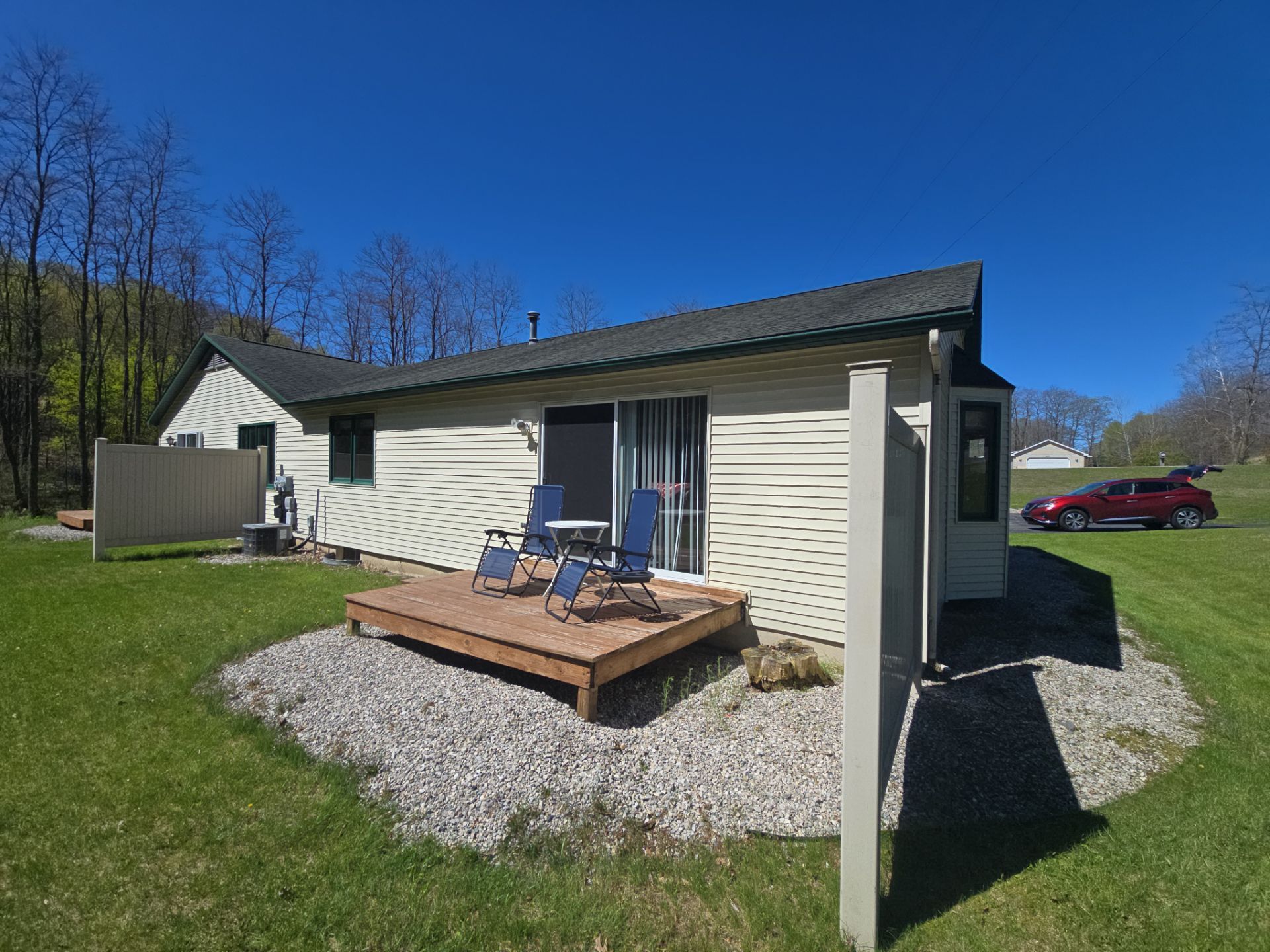 Gutter and Downspout Installation for Residence and Detached Garage in Traverse City by Rainbow Seamless Systems