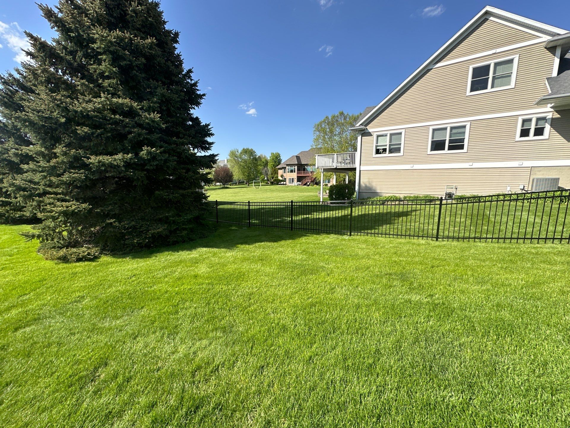Black Ornamental Metal Picket Fence Installation in Waterloo by Perfect Picket Fence and Stain