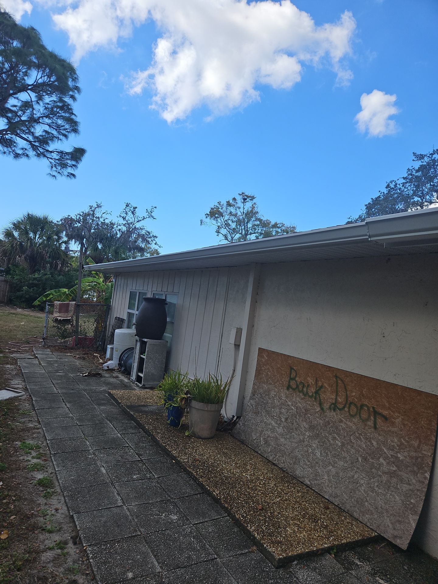 Downspout Installation using White Down Spouts in Sarasota FL by Gutter Professors