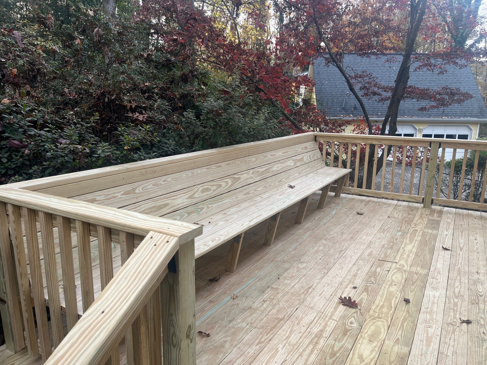 Deck Resurface with Wood Bench Install Using Pressure Treated Pine by Nelson Exteriors 