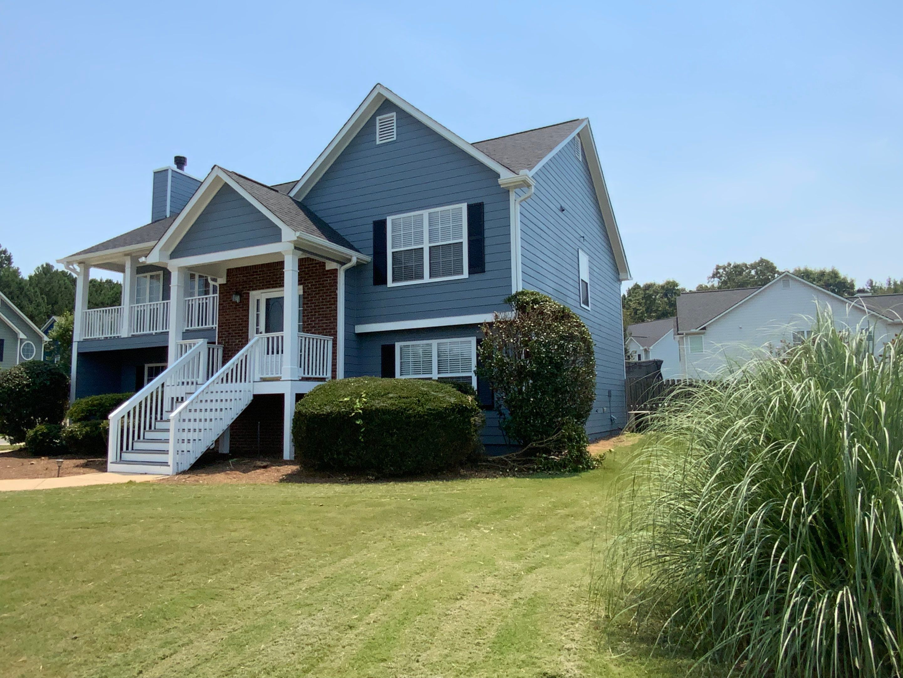 Comprehensive Exterior Painting for Cartersville Home with Blue Siding Transformation by Swift Home Renovations