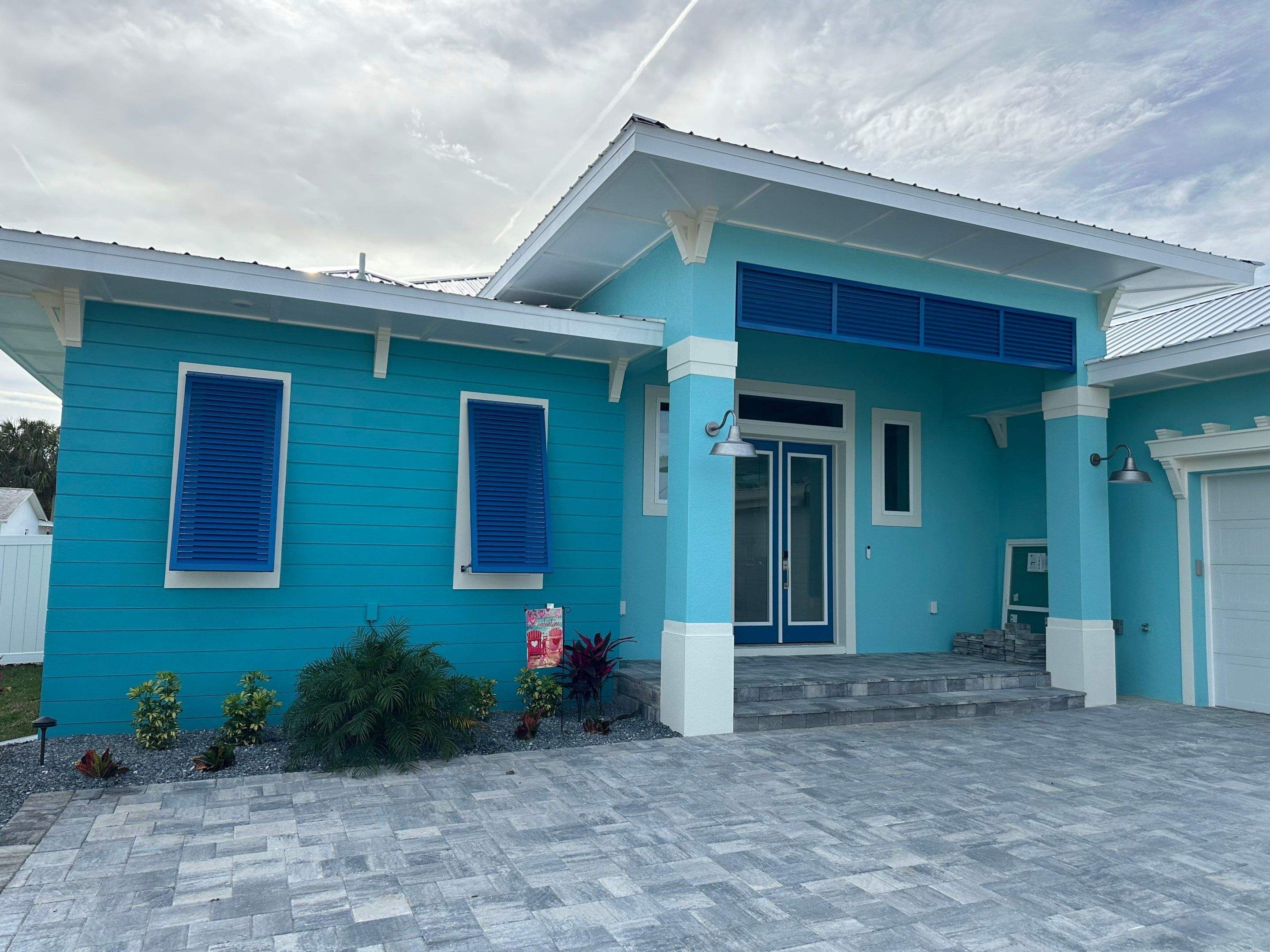 Bahama Shutters in Capri Blue by Smart Guard Shutters