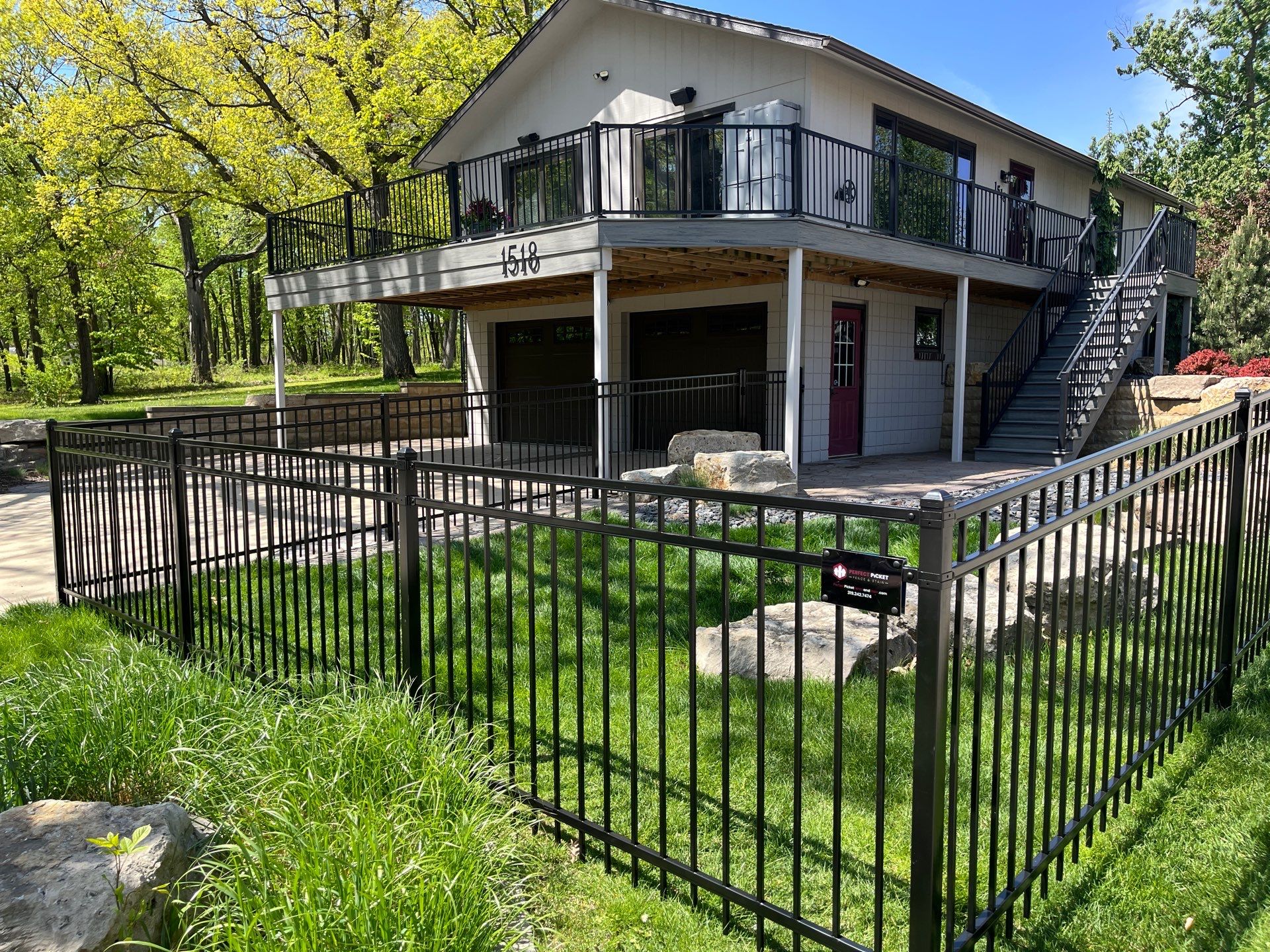 Ornamental Black Metal Picket Fence Installation in Cedar Falls by Perfect Picket Fence and Stain