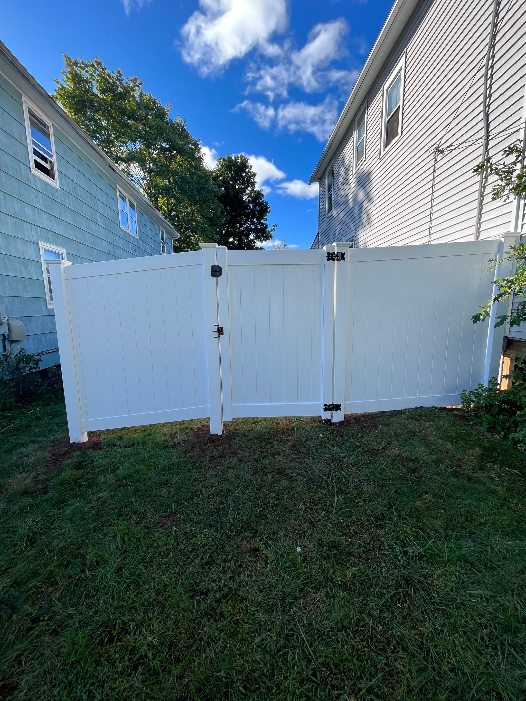 Vinyl Privacy fence with matching gate, White by DiGiorgi Roofing and Siding Inc