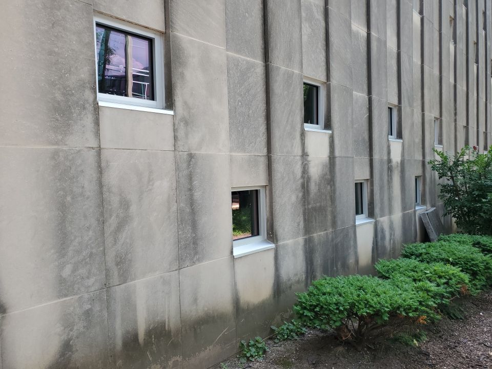 Courtyard pressure washing difficult access.  by Northern Power Washing LLC.
