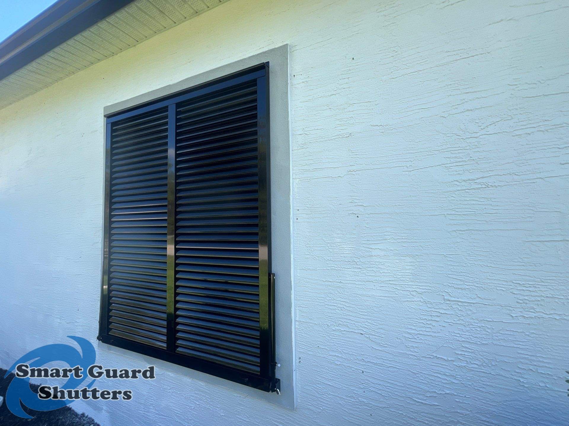 Impact Bahama Shutters in Jet Black by Smart Guard Shutters