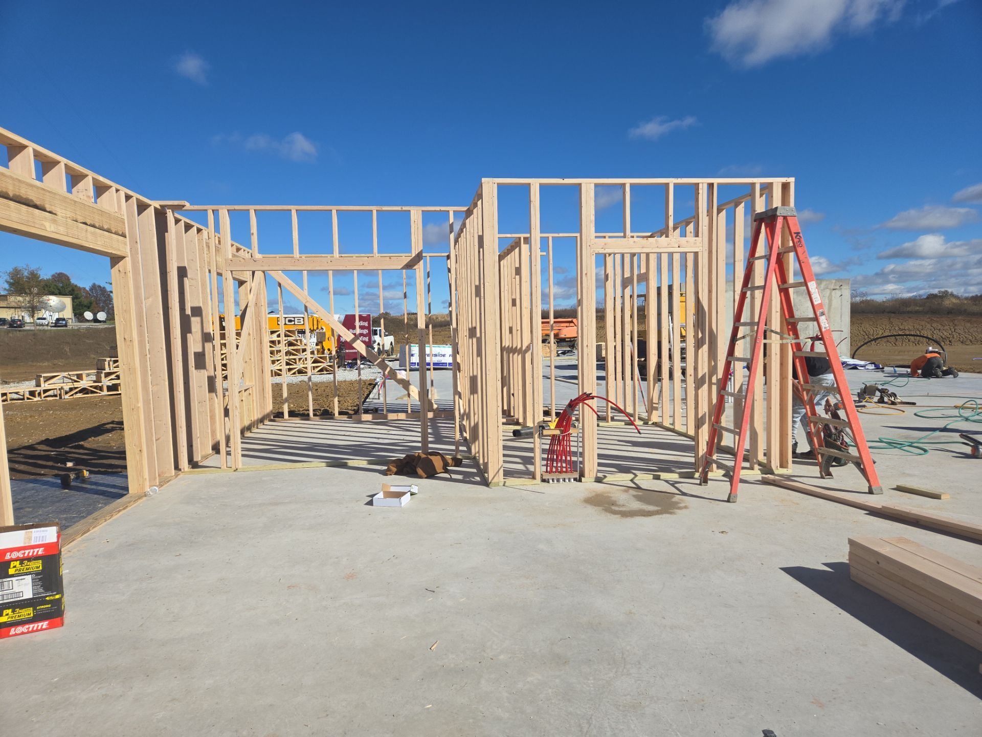 New Home construction w/ board and batten sides and metal roof  by Miles Construction 