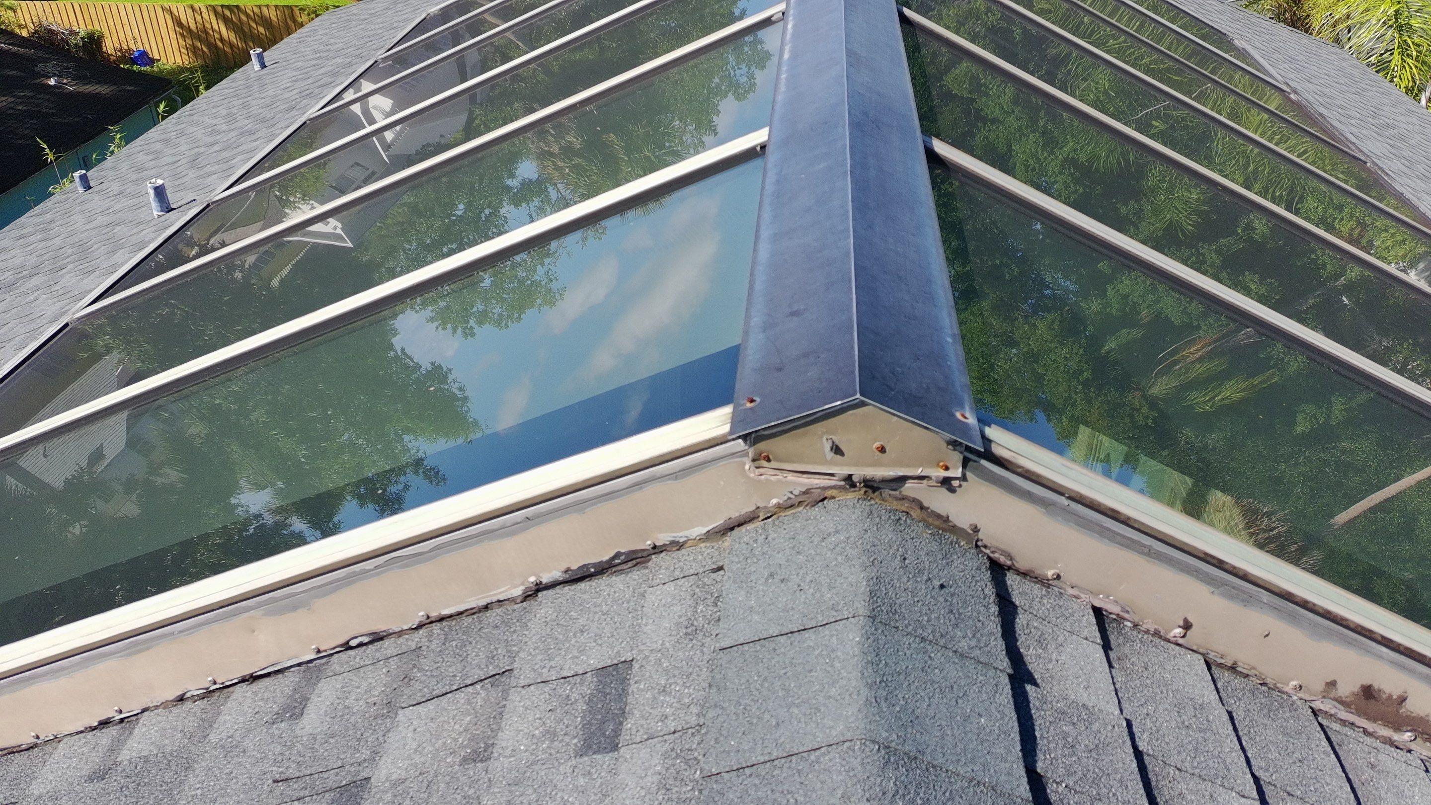 Ridge Skylight Repair and Shingle Roof Maintenance in Winter Park by Fortified Roofing Solutions Corp.