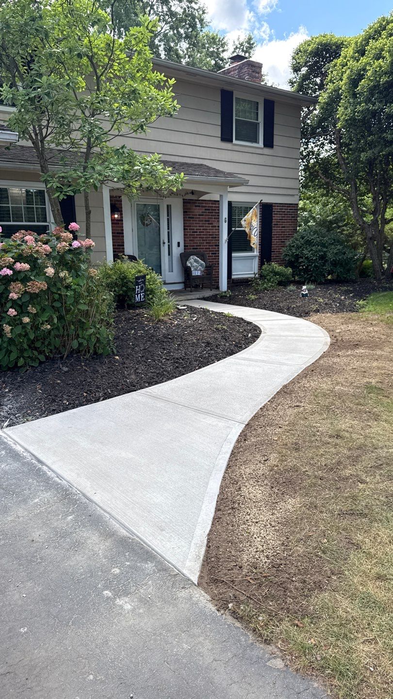 Broom finished concrete patio and sidewalk  by NG Masonry & Construction LLC