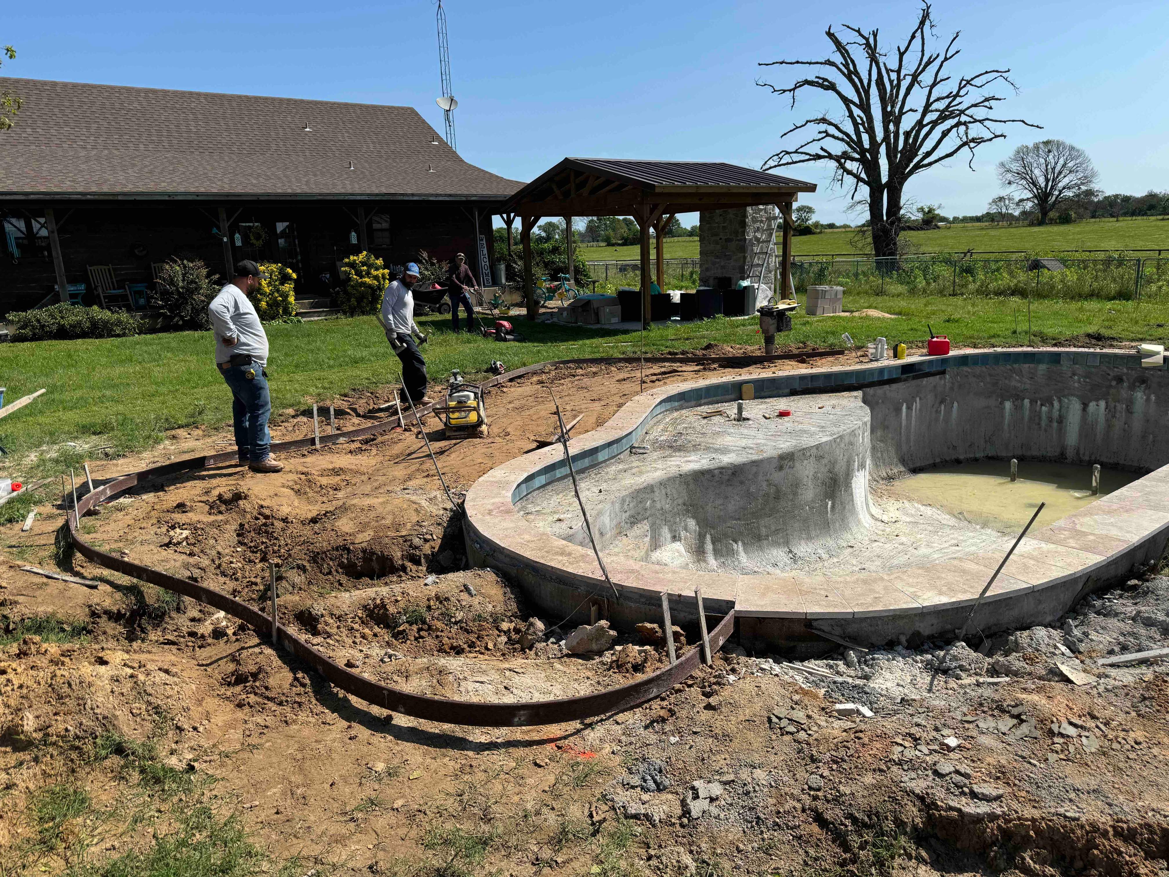Freeform Pool with Sun Ledge on Rural Lot by Pinnacle Pools and Spas - DFW