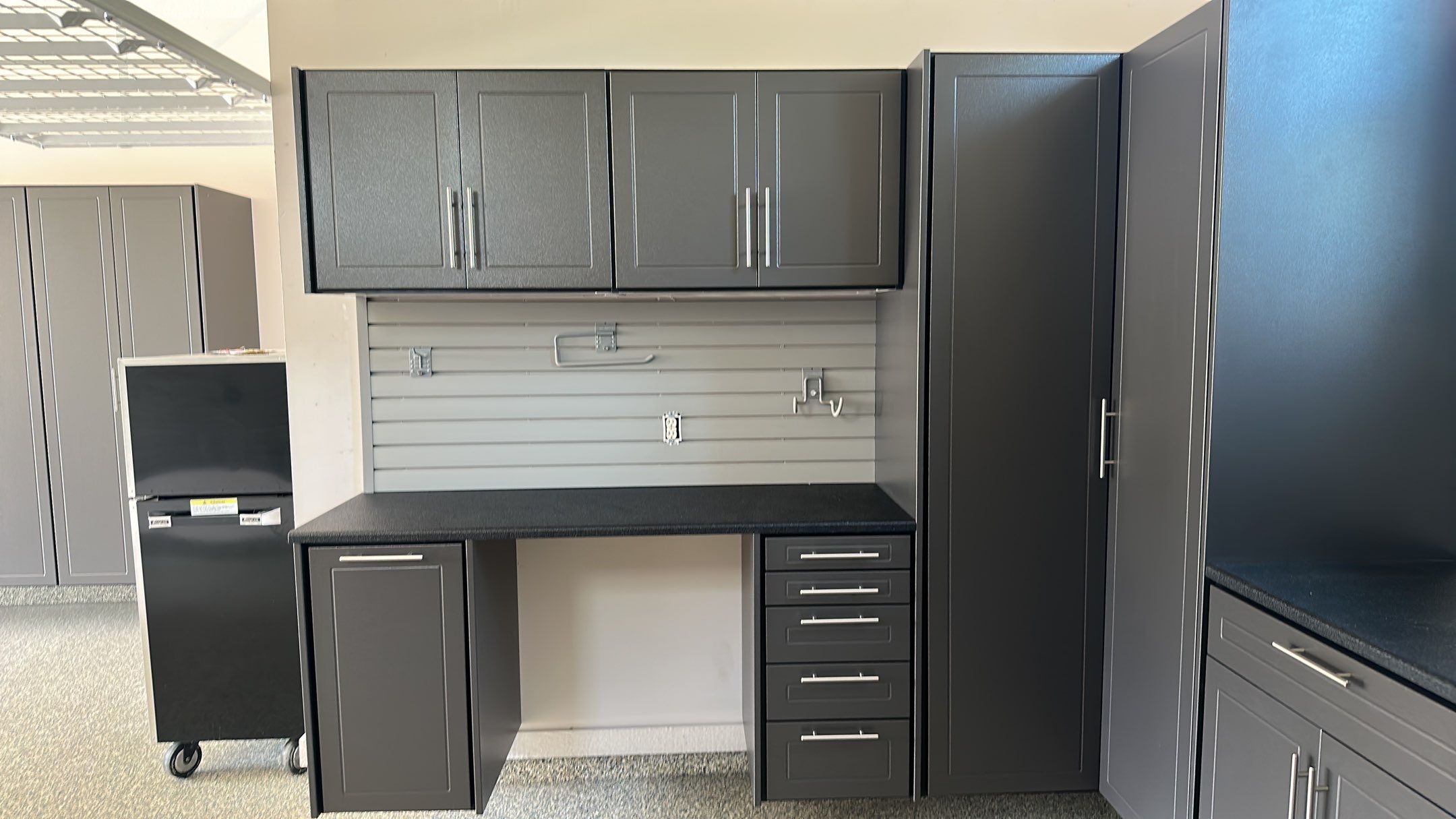 Lori H. upgrade her garage with cabinets and overhead racks by Banner Garage