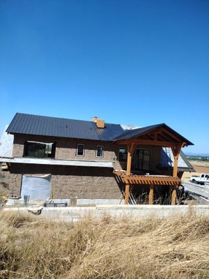Residential Metal Roof Installation using Taylor Metal Snap Lock Metal Color: Black