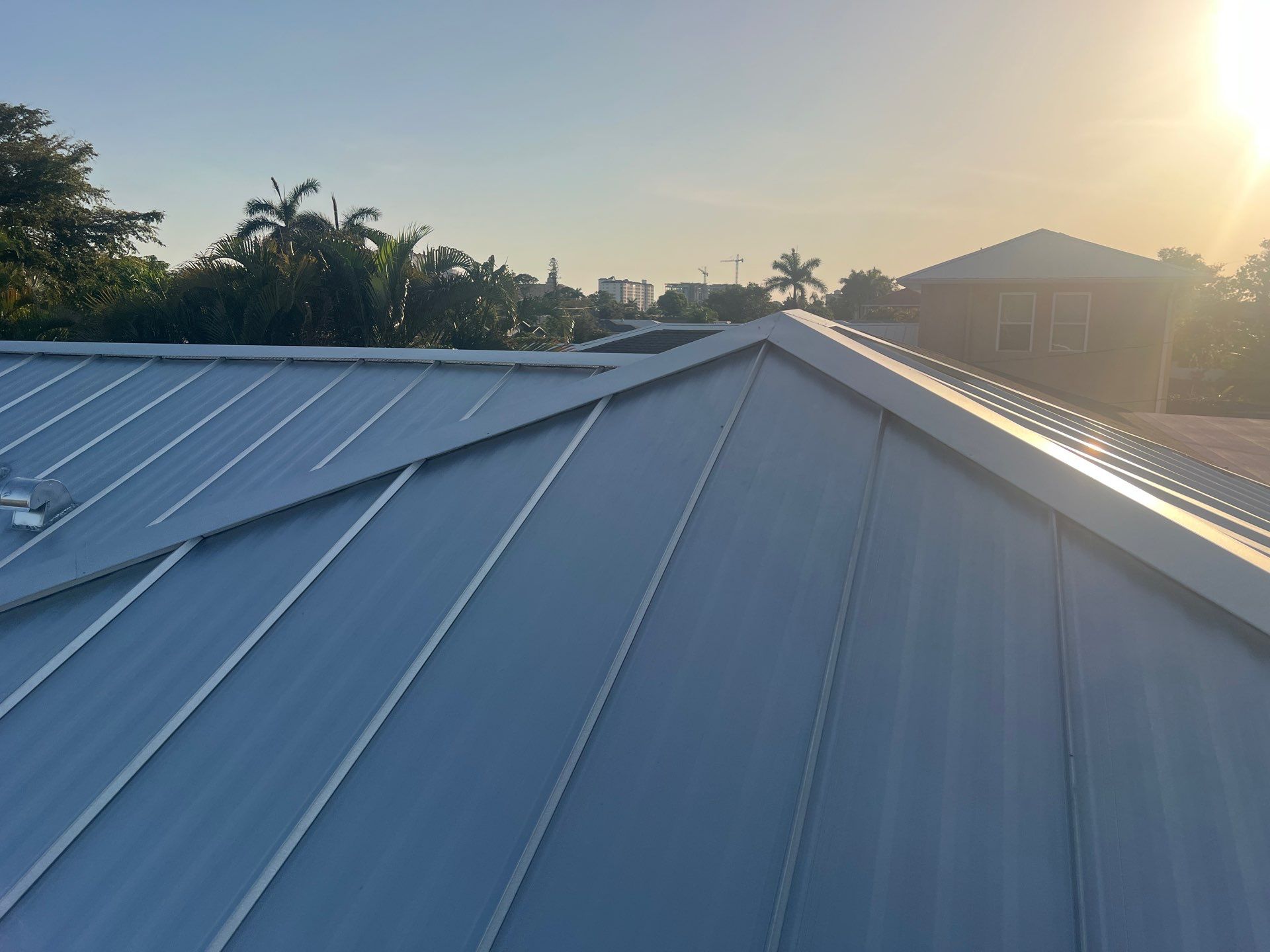 Residential Roofing Installation using Galvalume Standing Seam by Durabilis Roofing INC