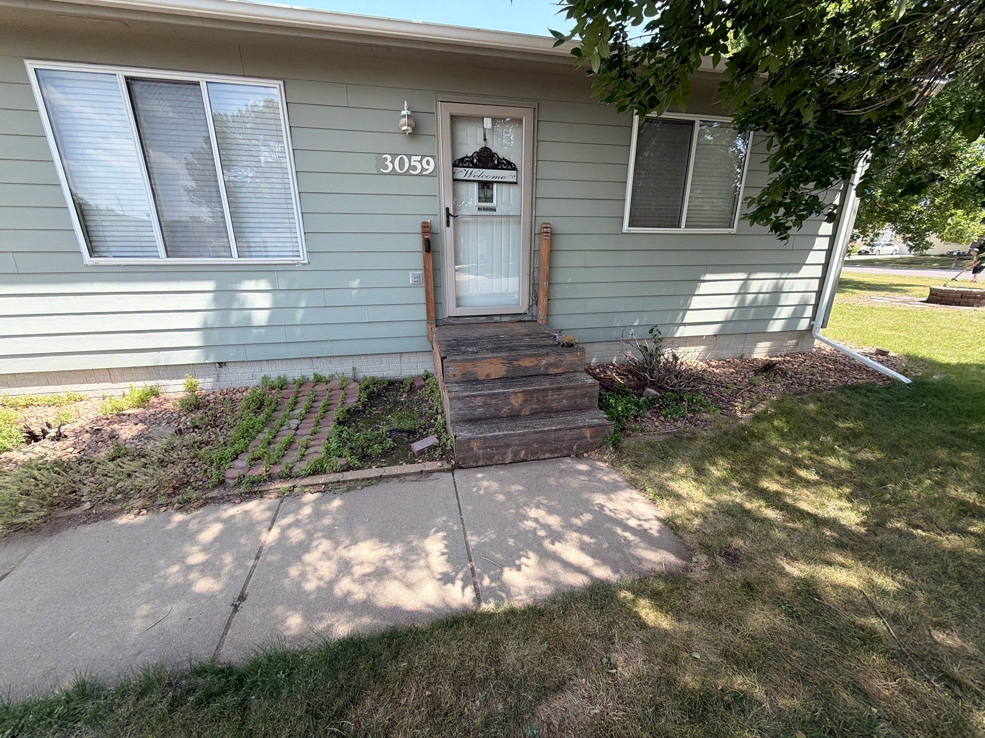 Sioux Falls Front Entry Composite Deck Build with Metal Railings by Select Painting, Coatings & Garage Cabinets