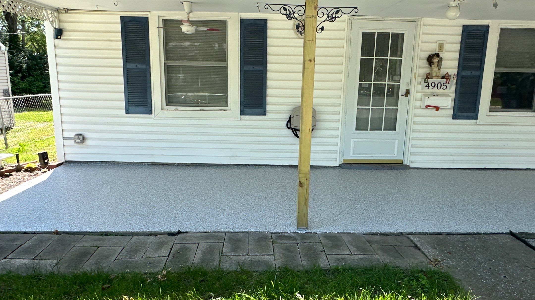 Look at this beautiful Coyote flake floor on this patio by Banner Garage