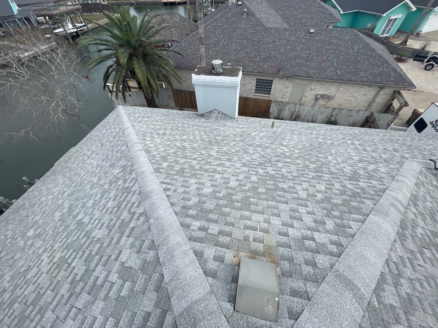 Residential Roofing Repair using Galvanized Chimney Cap & Chase by Lighthouse Roofing