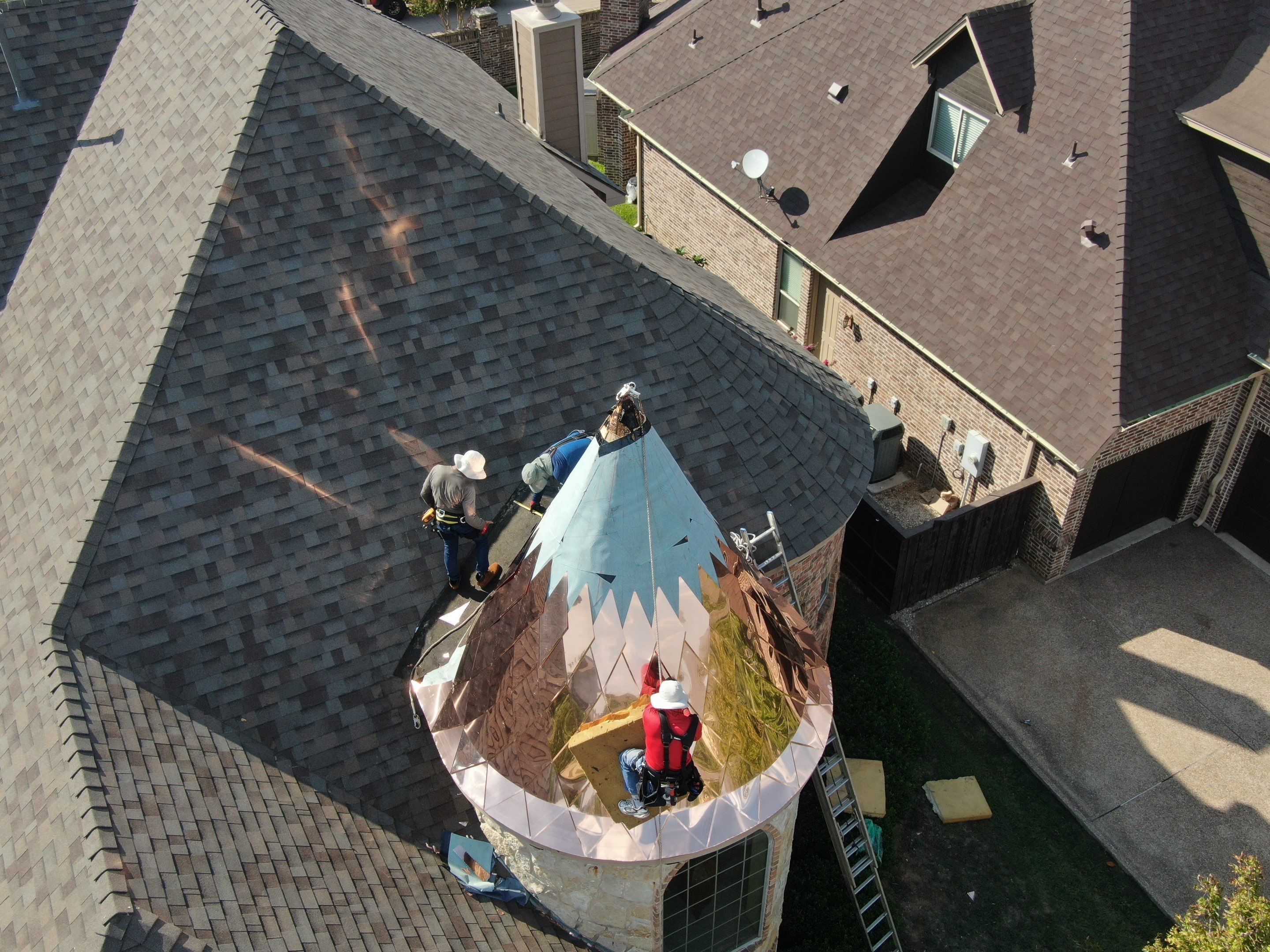 Installing Custom copper turret and Malarkey Vista Class 4 shingles Hail Damage Upgrade by Becker Roofing and Exteriors