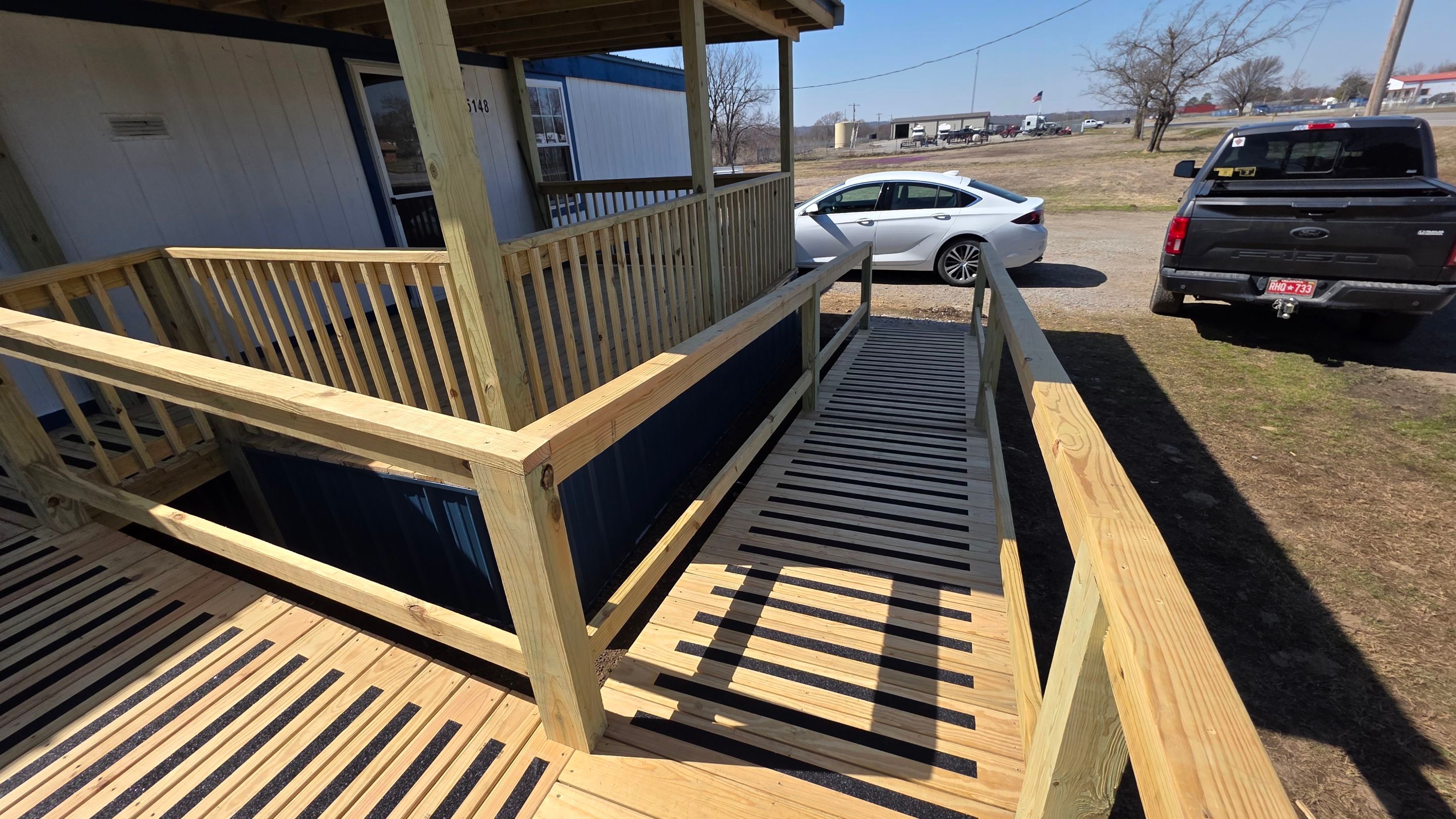 Covered Deck w/ ADA Ramp by In & Out Construction & Remodeling, LLC