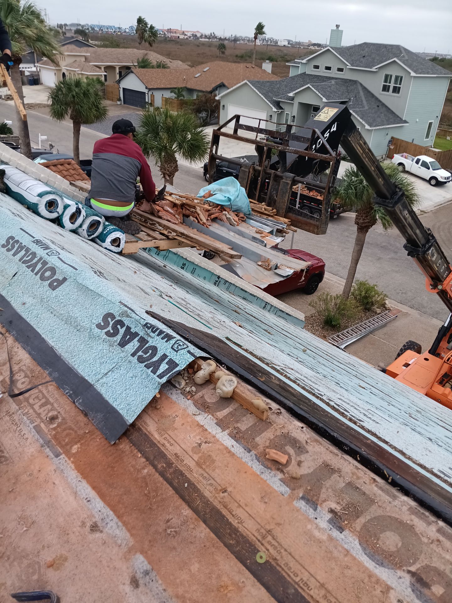 Off with the Tile and on with the TILCOR stone coated metal.  by Bayfront Roofing and Construction